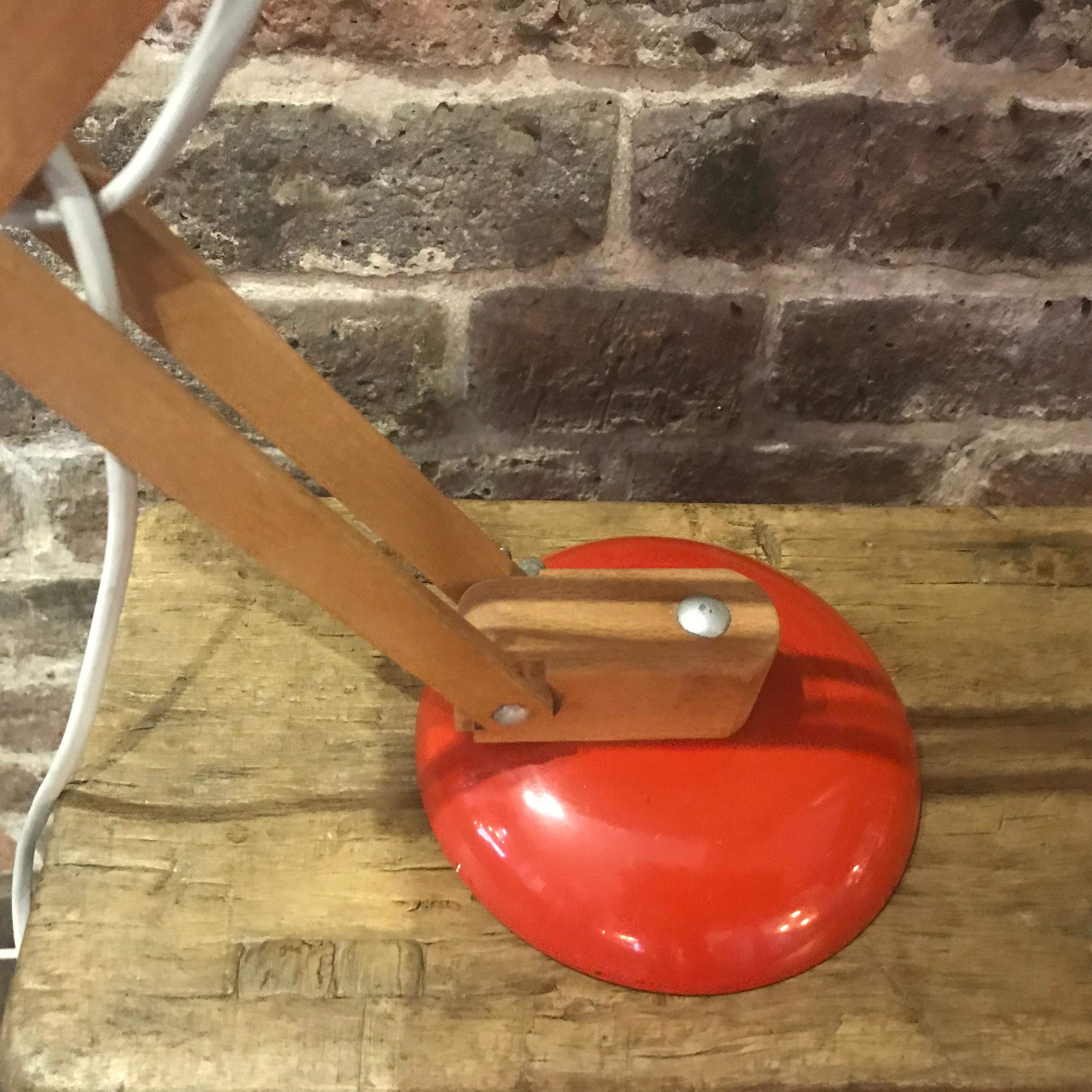 Vintage Maclamp desk or table lamp in orange with wooden arms. 

Designed by Terence Conran for Habitat in the 1950s, this lamp is an icon of the 1950s-1960s period.

In very good vintage condition. Some minimal signs of age, but nothing which