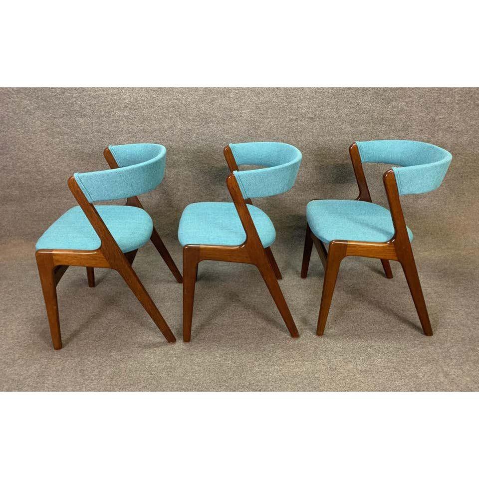 Here is a beautiful set of six 1960s Scandinavian modern dining chairs in mahogany in the manner of by Kai Kristiansen. This set, recently imported from Denmark to California before its restoration, features a solid mahogany teak frame and a new