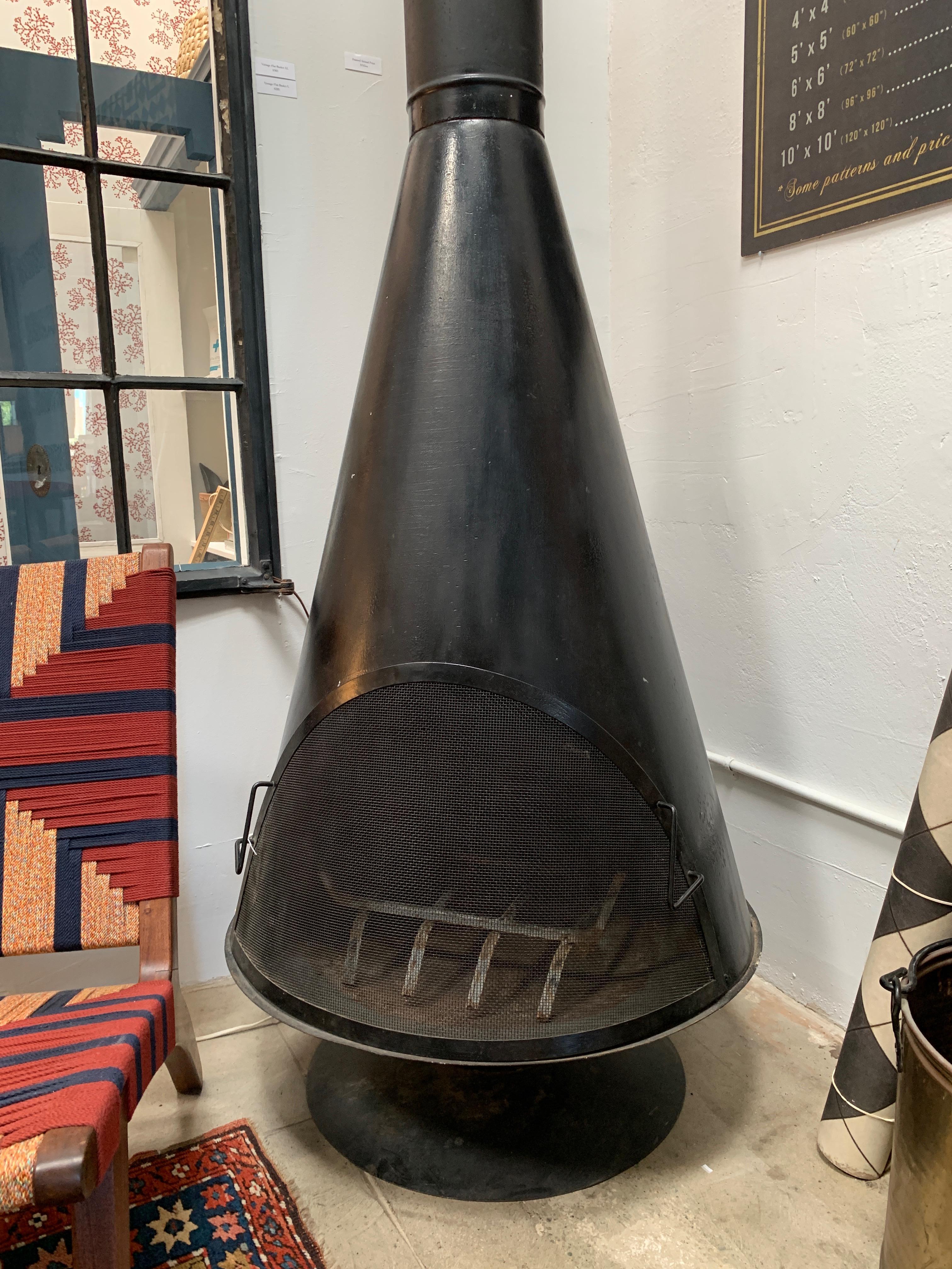 A beautiful vintage black Malm fireplace that can be used indoors or outdoors. Removable screen makes for easy wood loading and the sleek, timeless Scandinavian design makes it an effortless addition to any space.