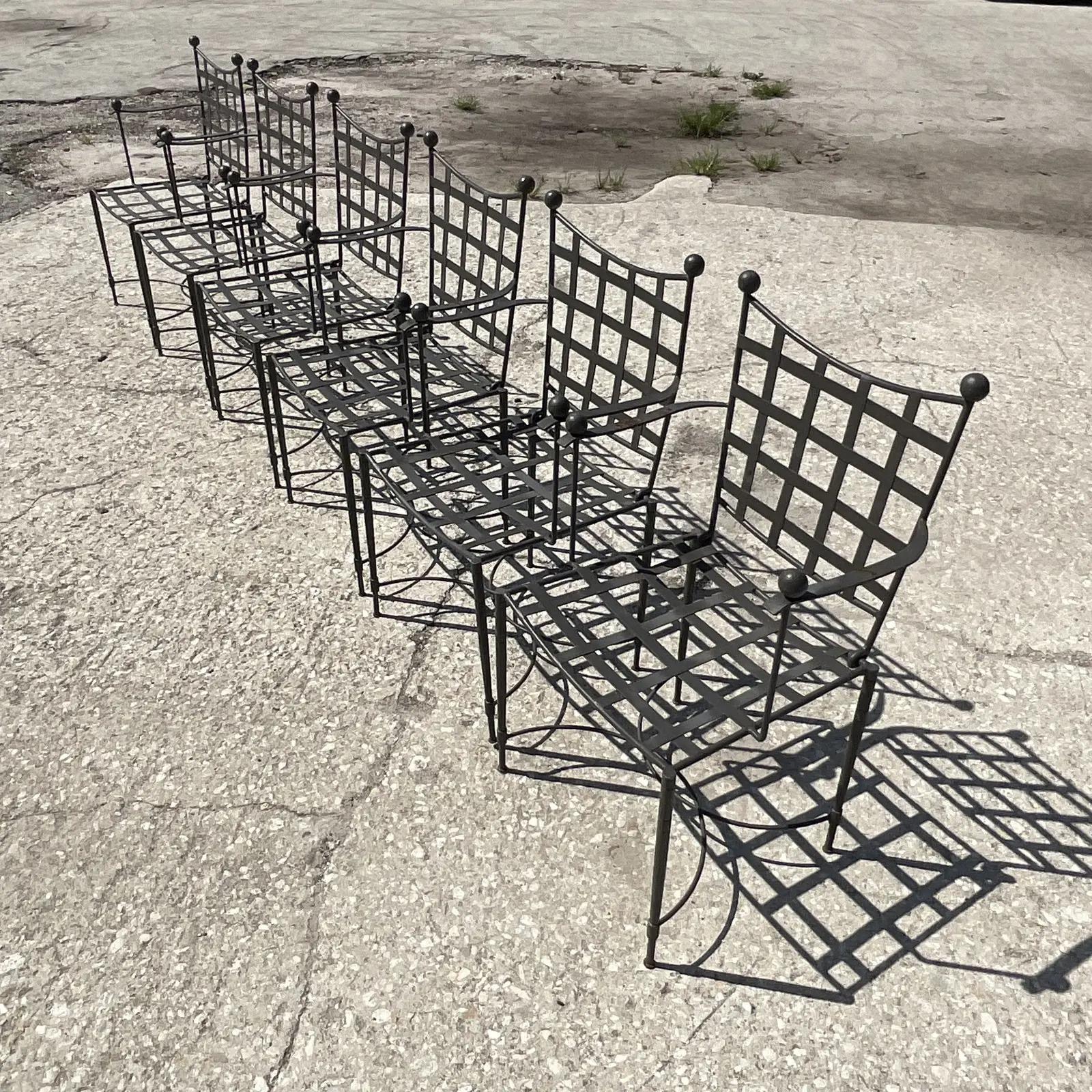 Fantastic vintage set of six mid-century wrought iron dining chairs. Designed by Mario Papparzini for Salterini. The real holy grail of patio chairs. Beautiful classic design with hammered legs and a clean design. Acquired from a Palm Beach estate.