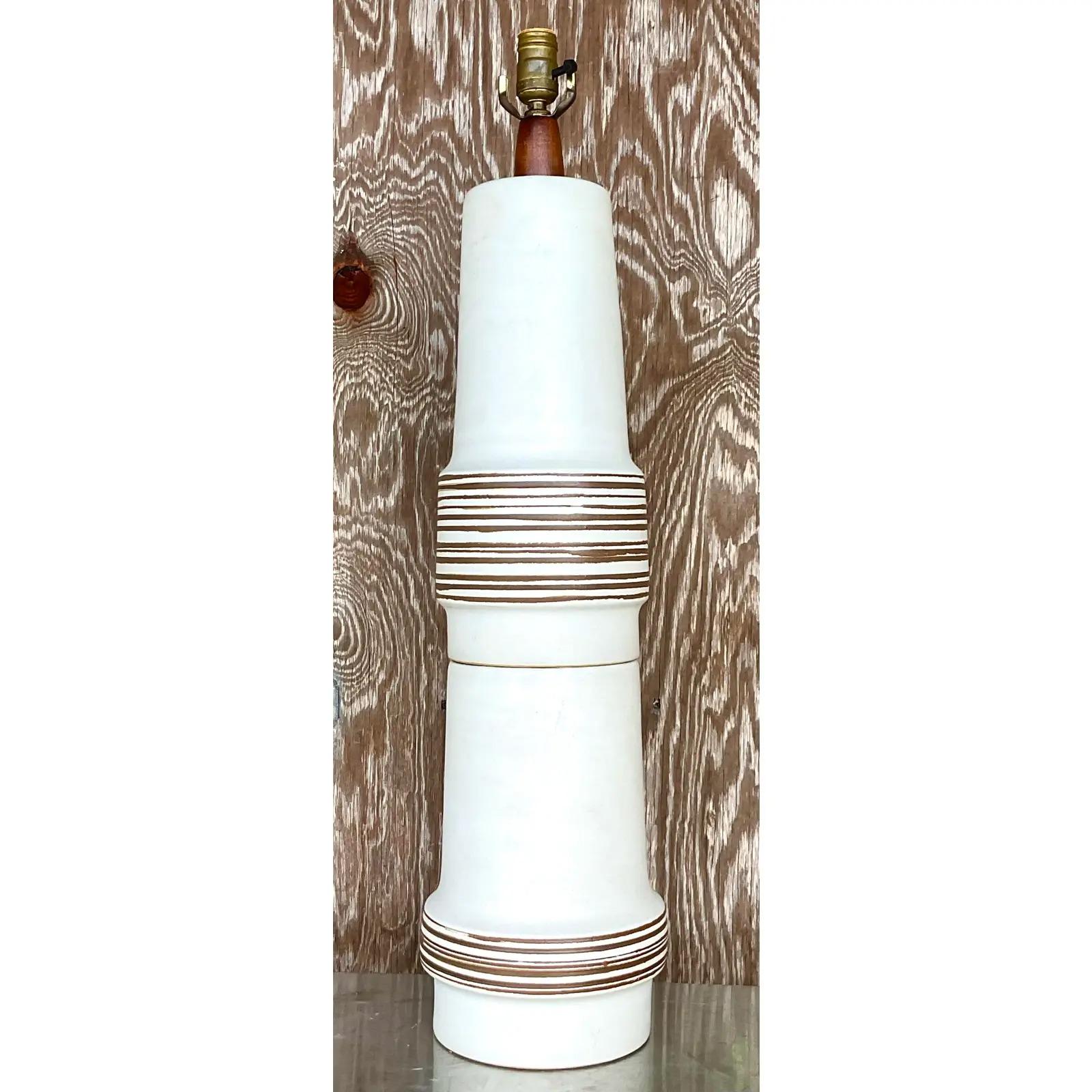 Fantastic vintage MCM table lamp. Made by the iconic Gordon and Jane Martz. A chic stacked ceramic body with a matte finish and hand painted center stripes. Signed on the bottom. Acquired from a Palm Beach estate.