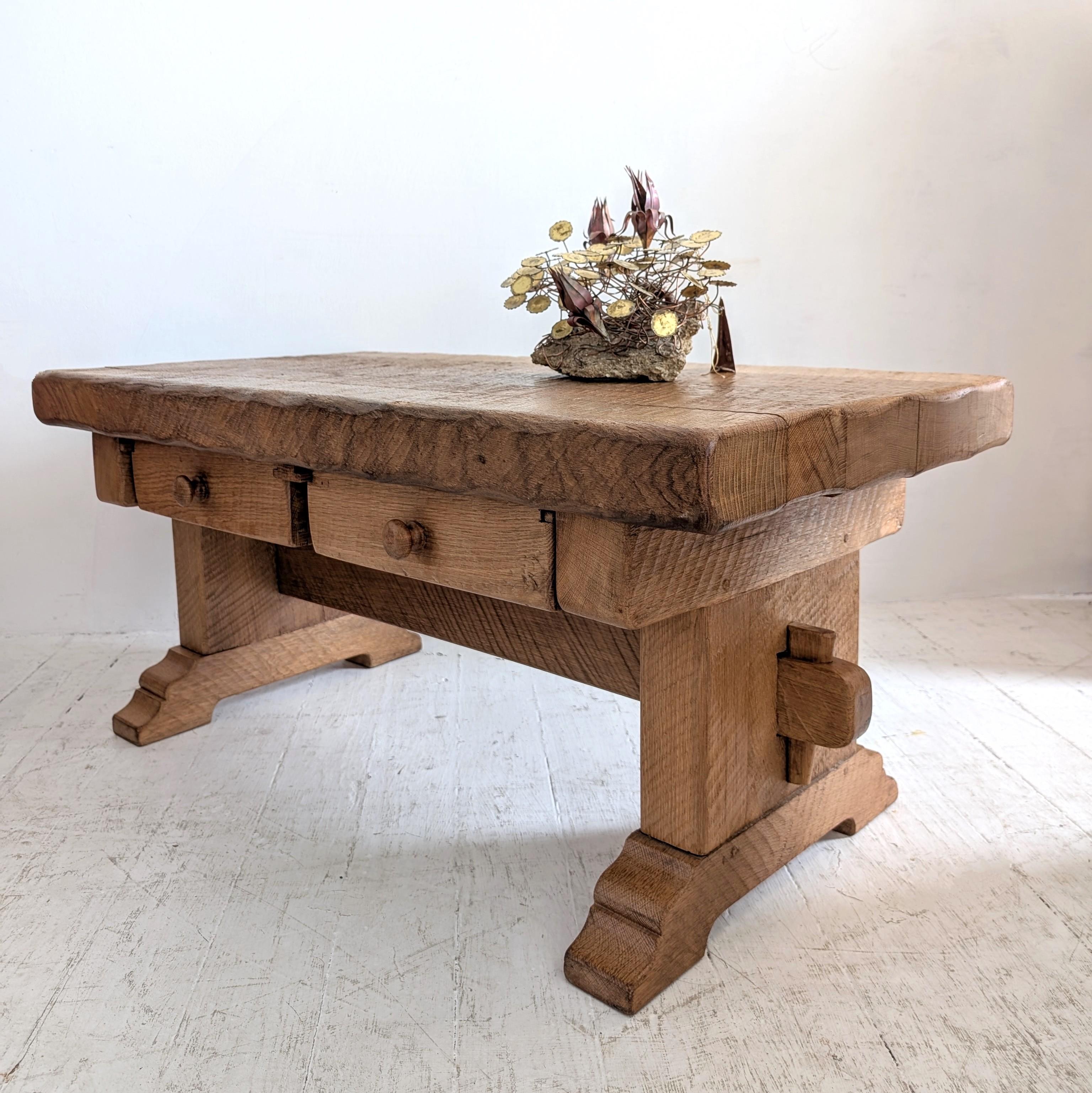 Vintage solid oak Brutalist / Arts & Crafts coffee table, Belgian c1970s. Two drawers which extend both ways (ie you can access them either side of the table). Makers mark underneath 

Dimensions: width 109cm, depth 58cm, height 49.5cm