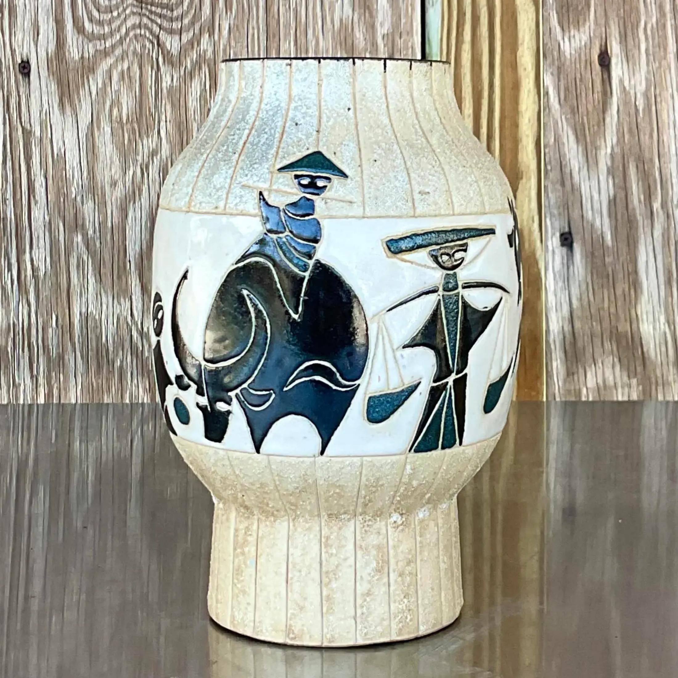 A fabulous vintage MCM ceramic vase. A chic etched line drawing of a Pagoda and the folks around it. Marked on the bottom. Acquired from a Palm Beach estate.
