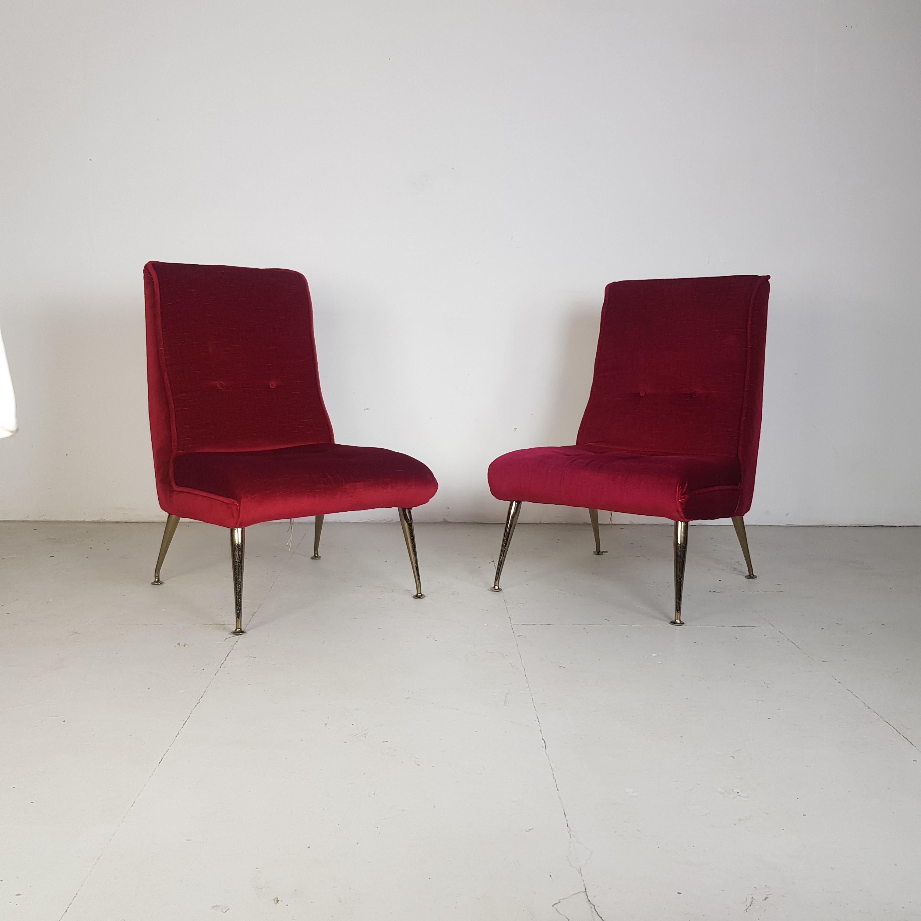 Nice pair of 1950s Italian style cocktail chairs. The upholstery looks to have been reupholstered at some point in red velvet and the feet are brass plated. In good vintage condition.

Approximate dimensions:

Height 82cm

Width 47cm

Depth