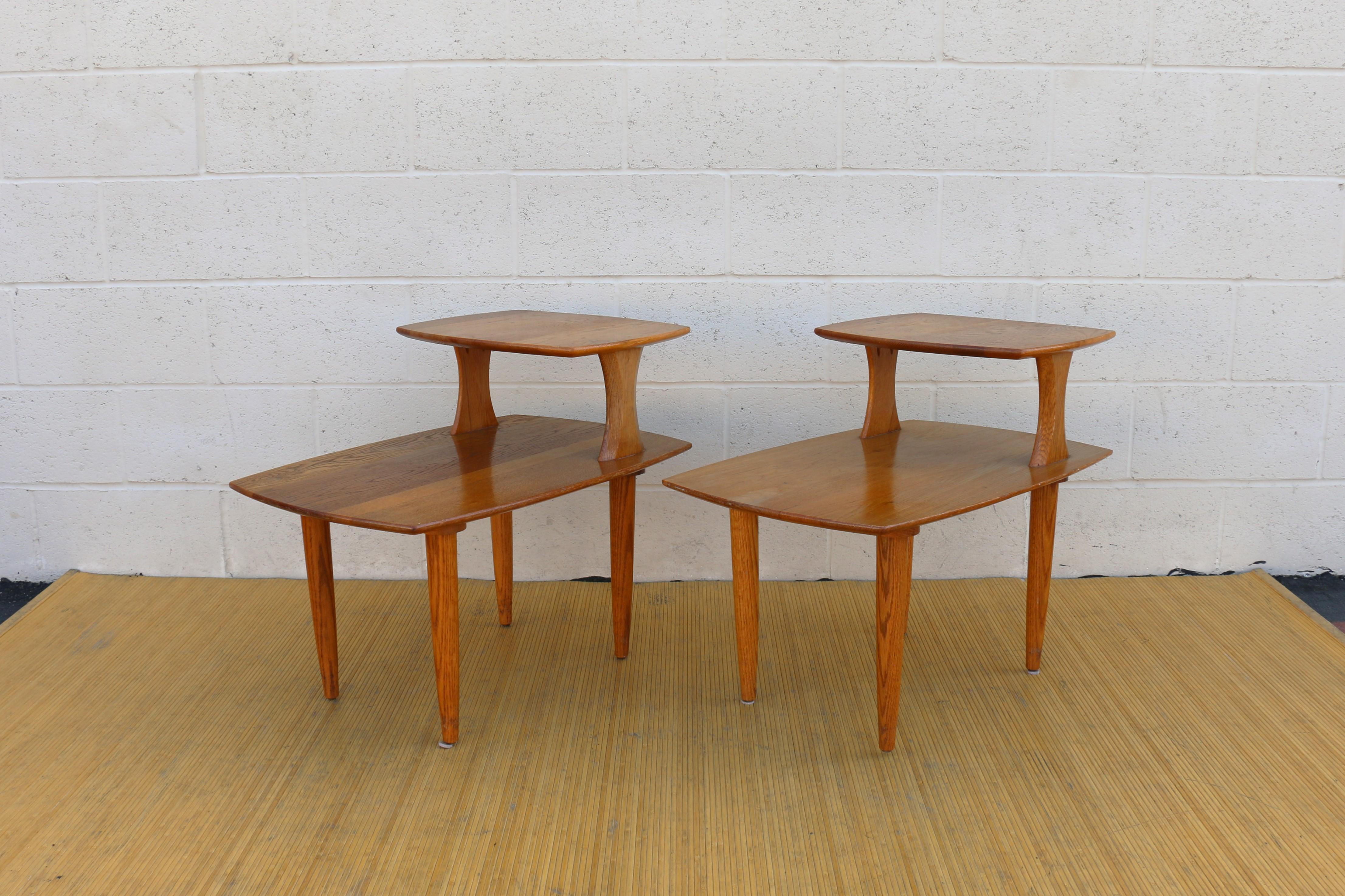 Wonderful pair of mid century modern side tables made of solid wood. They have two different levels. The style of this tables are absolutely beautiful and they are very well done. The grain makes them look even nicer and makes them stand out. These