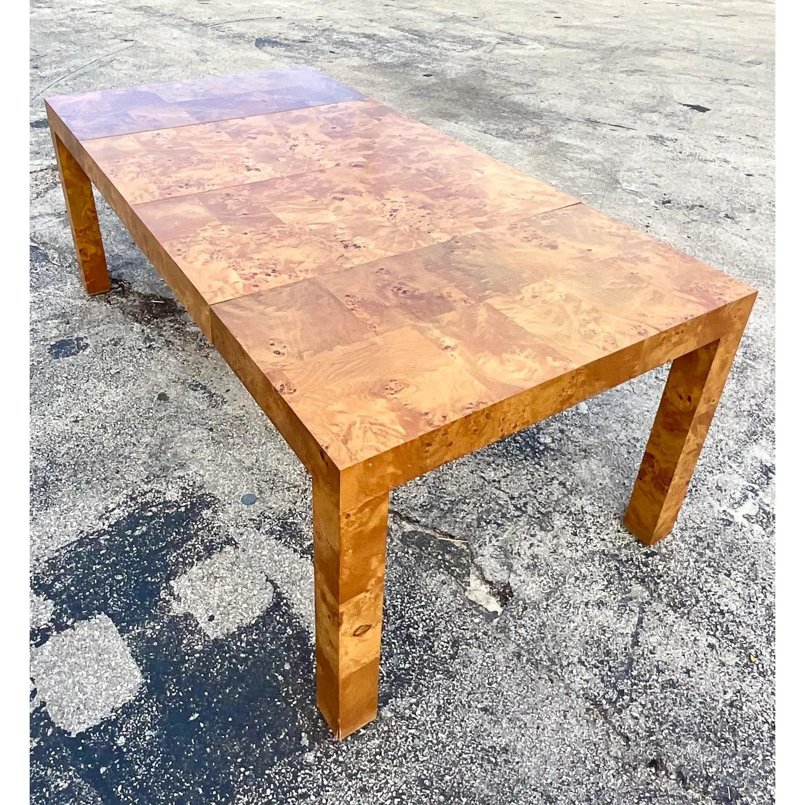 The most amazing vintage MCM dining table. Beautiful patchwork Burl wood in a chic parsons shape. Two leaves for maximum seating at 79 inches! Moves daily from game table to dining table. You decide! Acquired from a Palm Beach estate.

Leaf