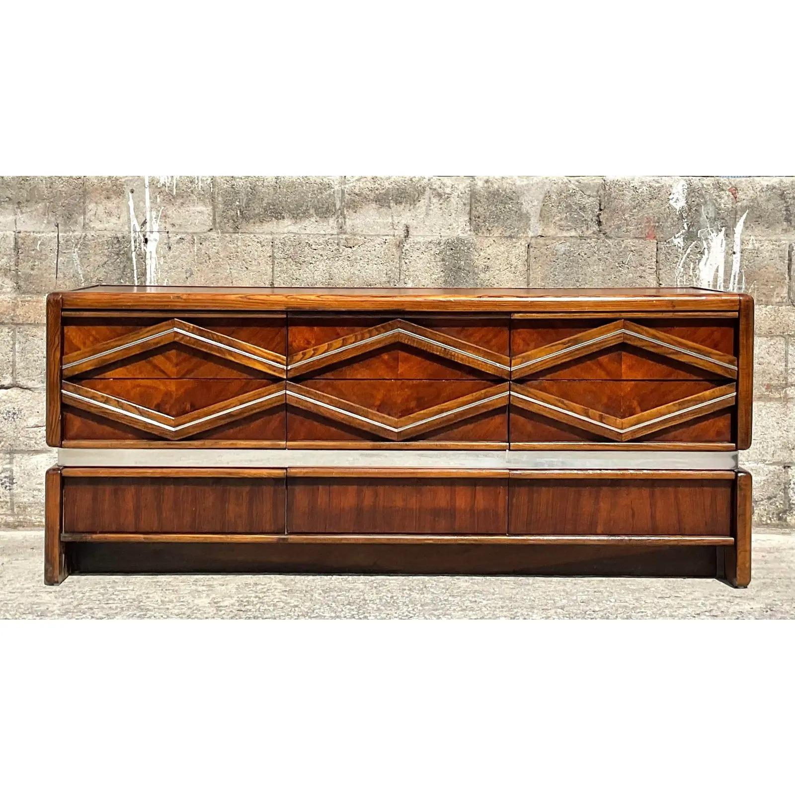 Vintage MCM chrome diamond dresser. Made by the iconic Pulaski group. A striking diamond design makes this piece really stand out. Matching nightstands also available. Acquired from a Palm Beach estate.