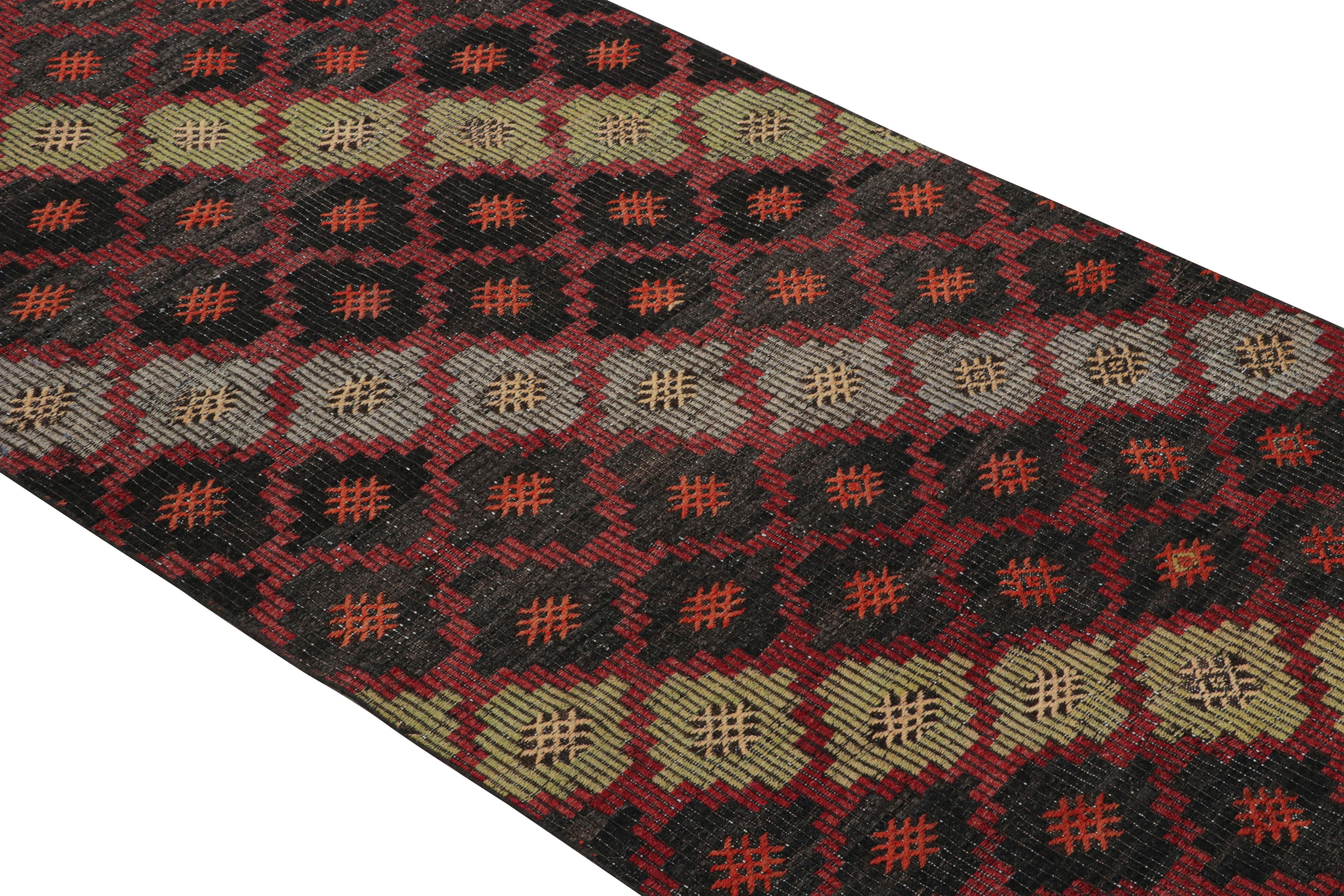 Handwoven in Turkey originating between 1950-1960, this vintage midcentury wool Kilim rug enjoys a meticulous play of embroidery and flat weaving, uncommon and distinguishing of a select line from our recent additions to our collections. This