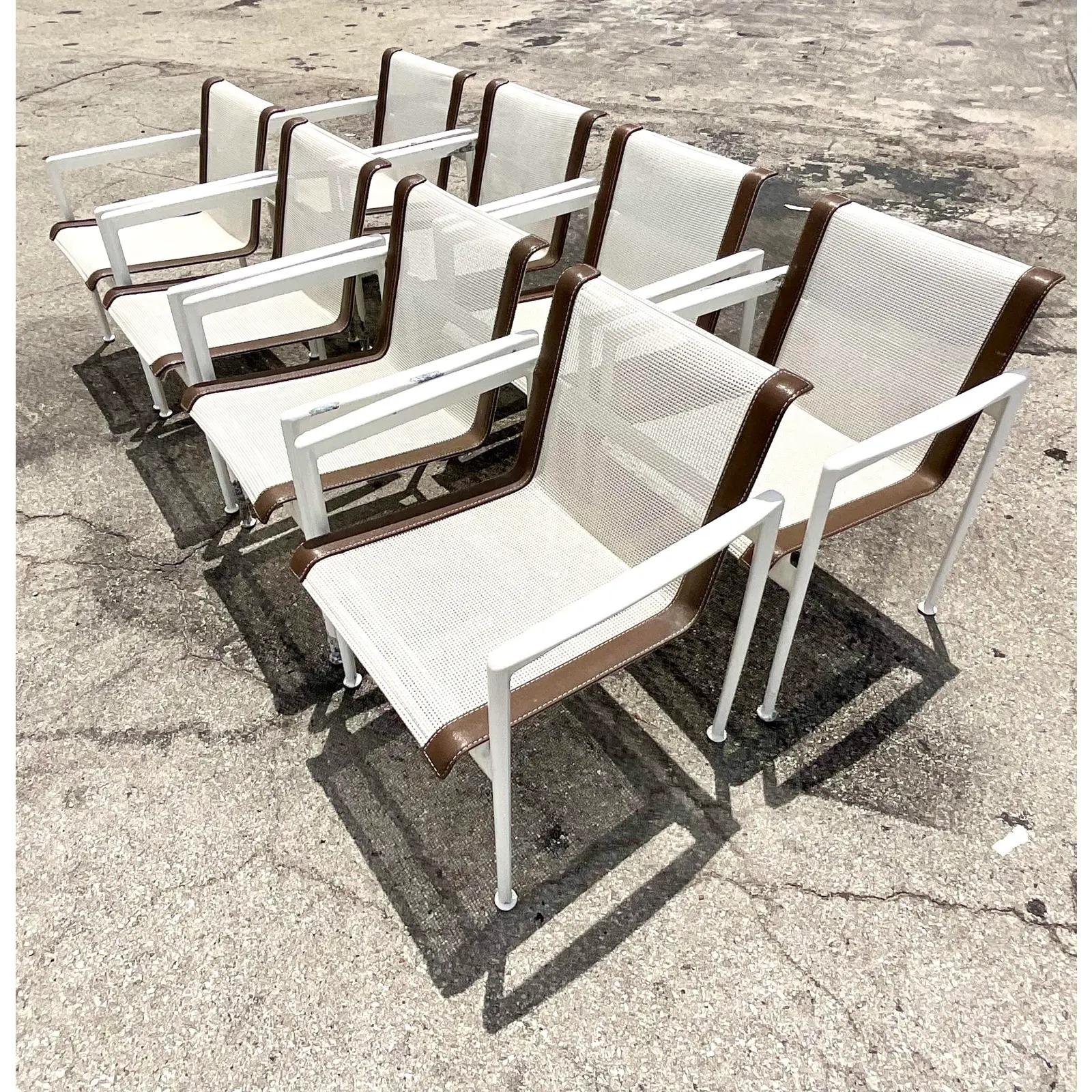 A fantastic set of 8 vintage outdoor dining chairs. Made by the iconic Richard Schultz and tagged on the bottom. White mesh seats with brown end straps. Matching pieces also available. Acquired from a Palm Beach estate.