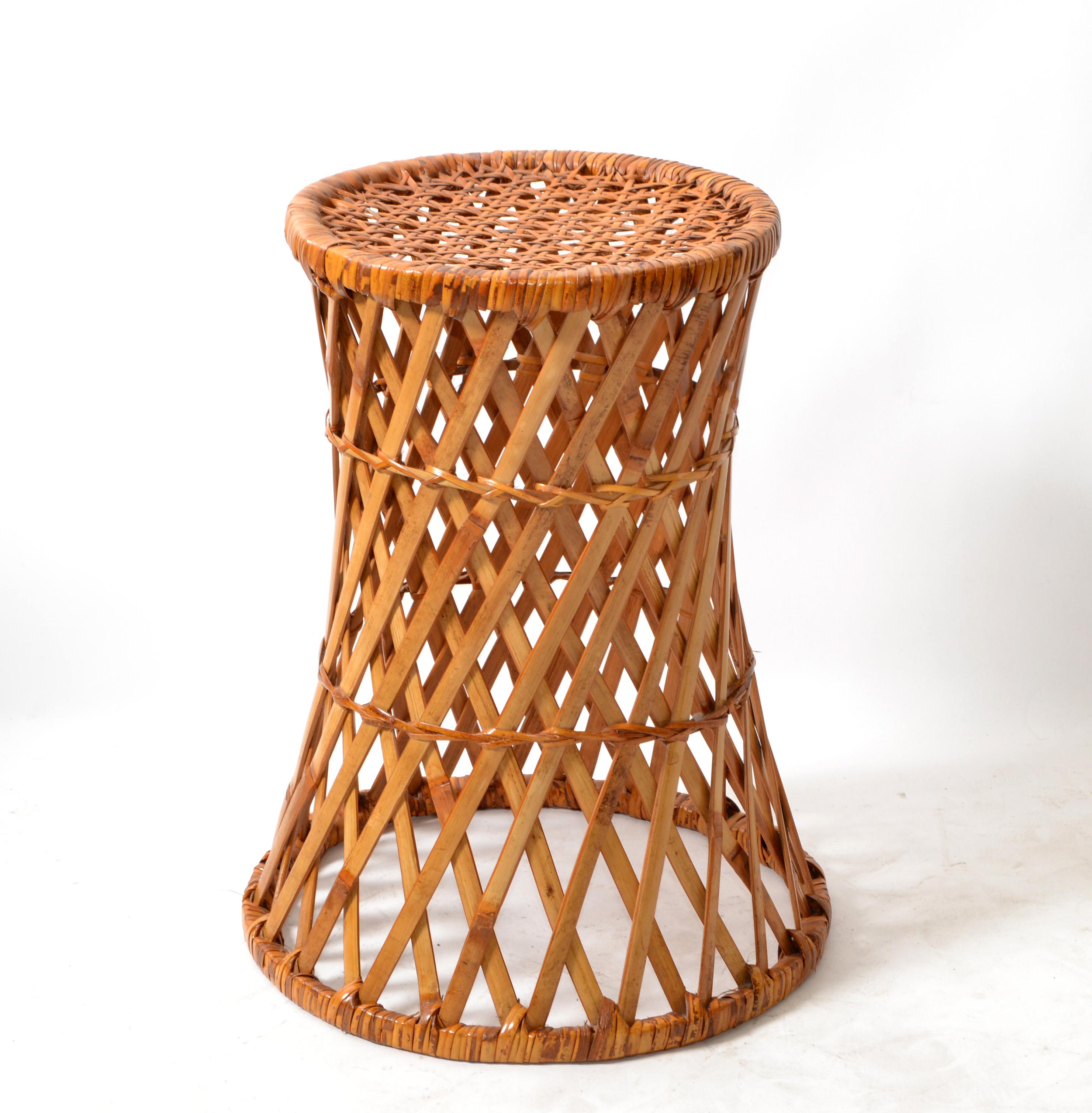 All handwoven cone shaped Bamboo, wicker and rattan drum table, side table, drink table or stool in Bohemian period style.
Top diameter measures: 11.13 inches.
Height: 18 inches.
Fully Restored Boho Chic piece ready for a new Tropical Home