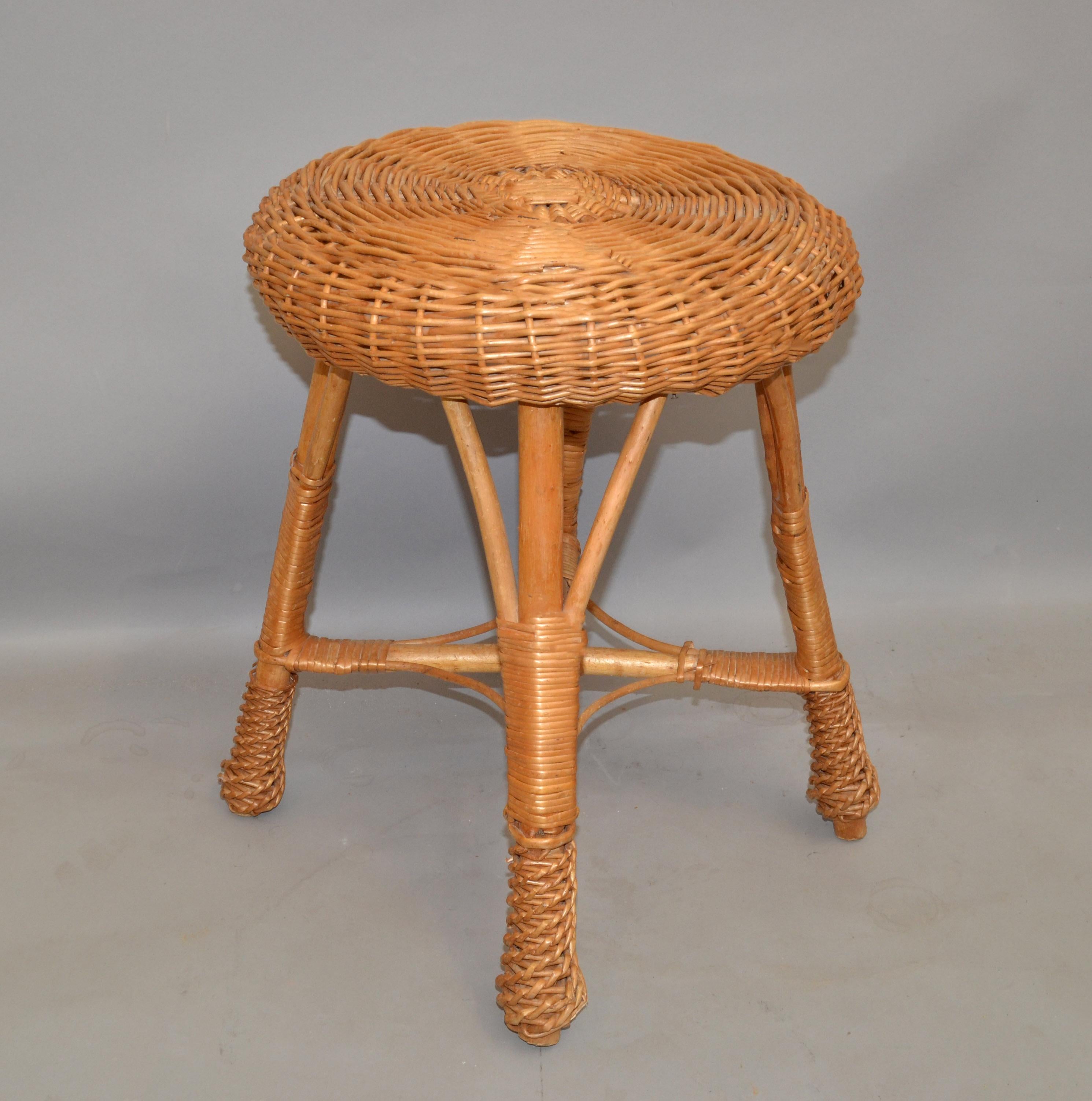 All handwoven cone shaped Bamboo, wicker and rattan drum table, side table, drink table or stool in Bohemian period style.
Top diameter measures: 15 inches.
height: 18.5/8 inches.
Good vintage condition with some missing links due to use and