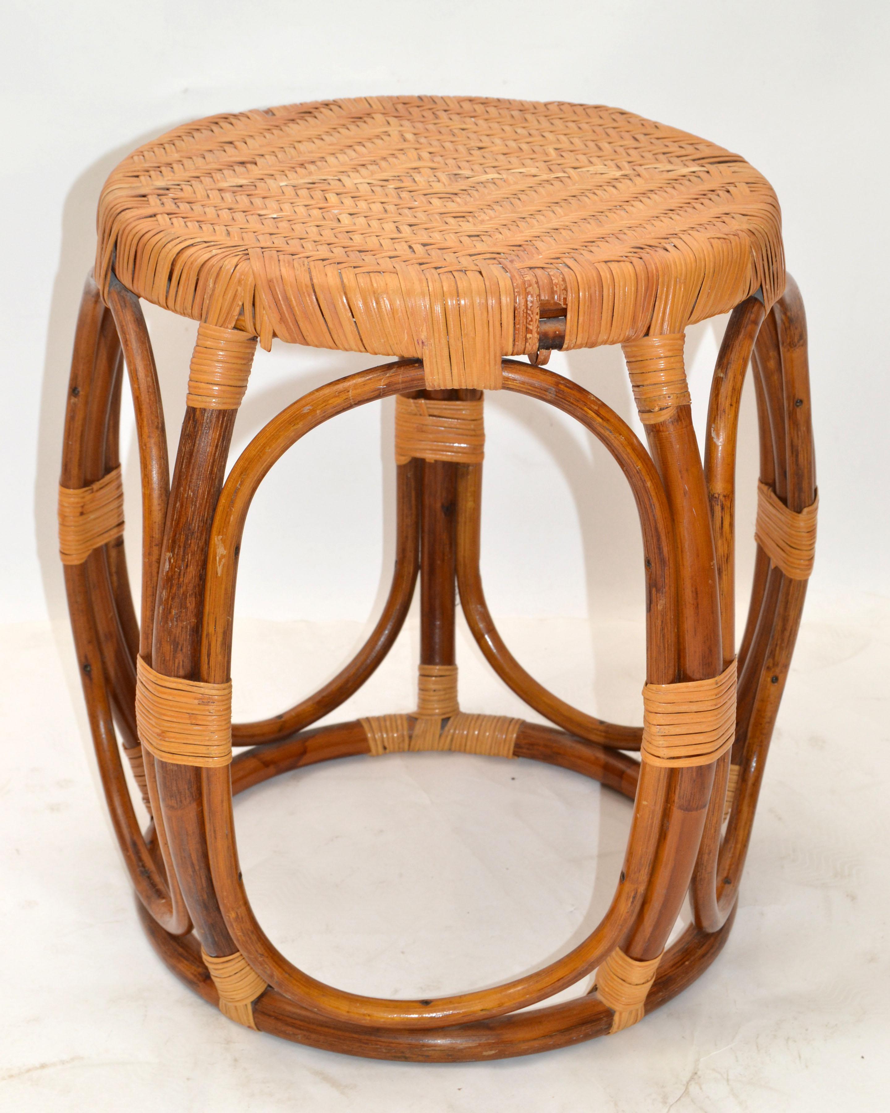 All handwoven wicker and rattan drum table, side table, drink table or stool in Bohemian period style.
Top diameter measures: 13.75 inches.
Height: 16 inches.