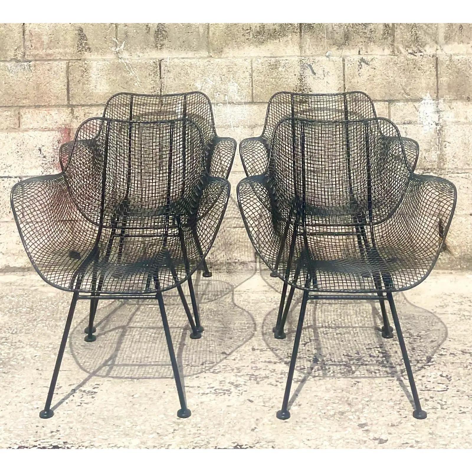 Fantastic set of four vintage MCM dining chairs. Made by the iconic Russell Woodard. A set of the highly coveted Sculptura collection. Fully restored with all new powder coated finish in matte black. All feet in perfect shape. Acquired from a Palm