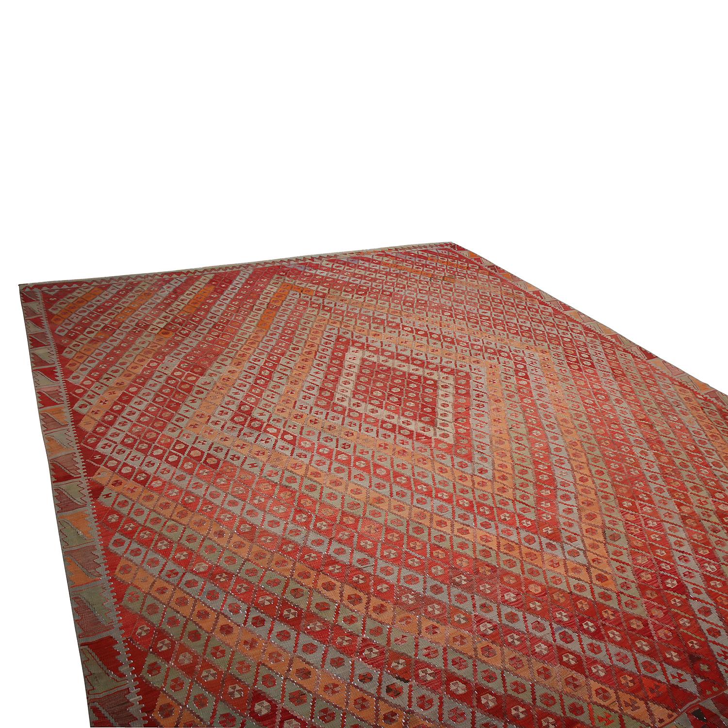 Handwoven in Turkey originating between 1950-1960, this vintage midcentury wool Kilim hails from the town of Sarkisla (Sarkisla) in the Sivas province, a widely regarded local of acclaimed Central Anatolian rarities. The diamond pattern in this