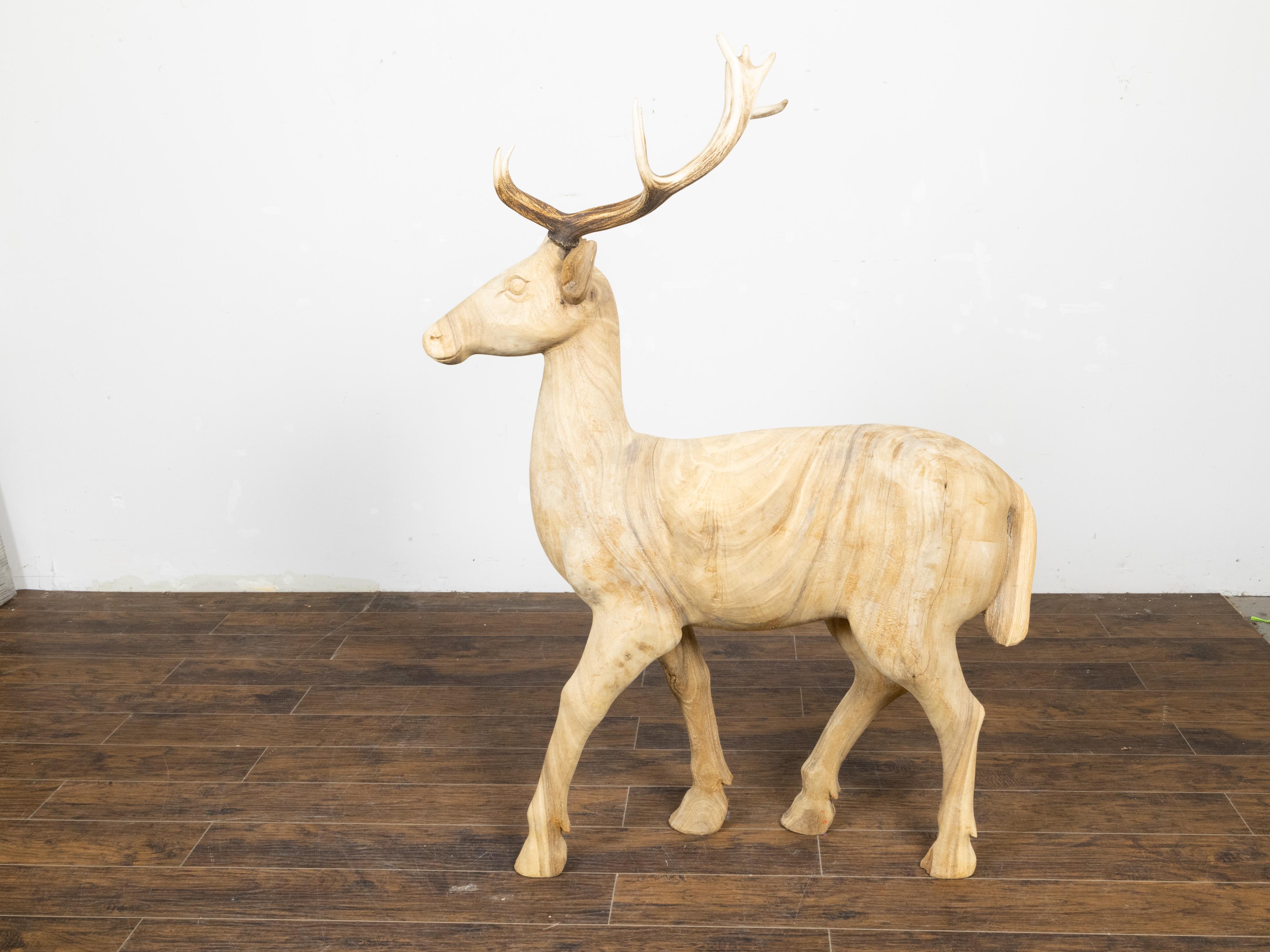 Carved Vintage Midcentury Sculpture of a Walking Stag with Antlers and Natural Patina For Sale