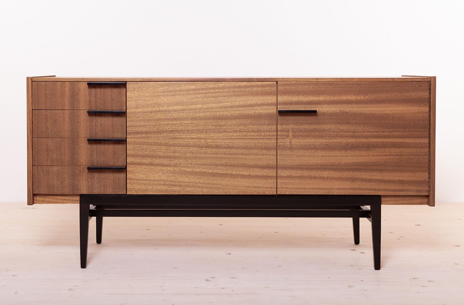 This exquisite sideboard, crafted in the 1960s in former Czechoslovakia, exemplifies the epitome of mid-century modern design. A testament to the renowned craftsmanship of UP ZAVODY and the creative vision of Frantisek Mezulanik, it embodies both