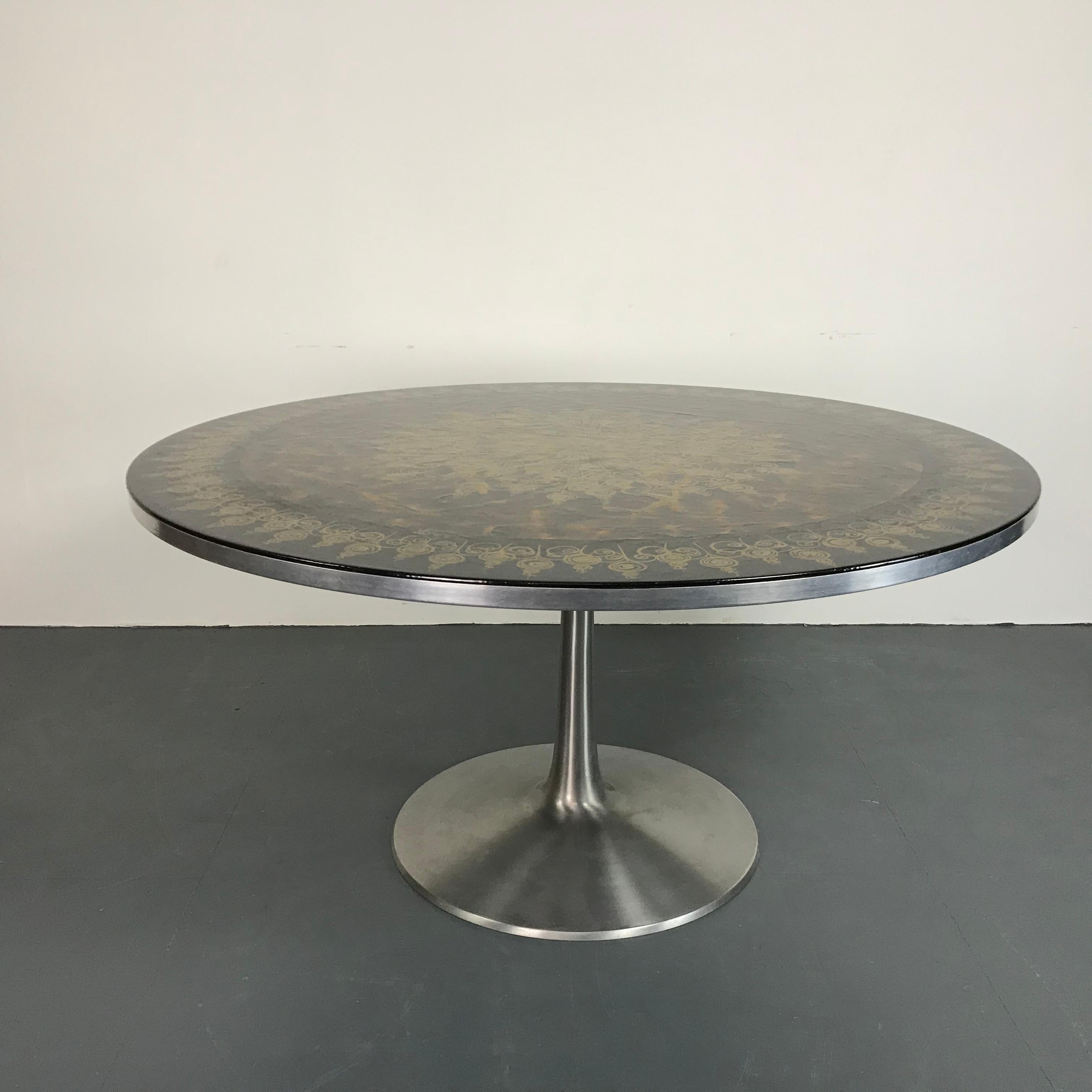 Beautiful midcentury tulip style dining table, designed by Poul Cadovius and decorated by Susanne Fjeldsøe. Manufactured by Cado in the 1960s.

In good vintage condition. 

Approximate dimensions: 

Height 70cm

Diameter 138cm.

A