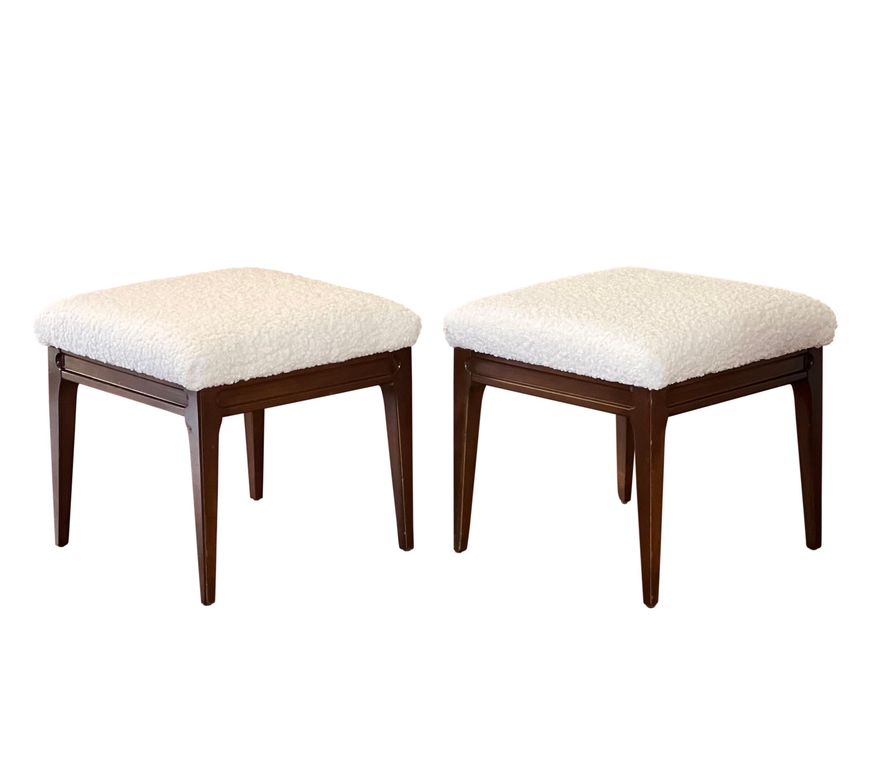 Elegant pair of vintage mid century walnut bouclé stools or benches, newly reupholstered.

The versatile pair has many possibilities with a super clean style. In very good condition.