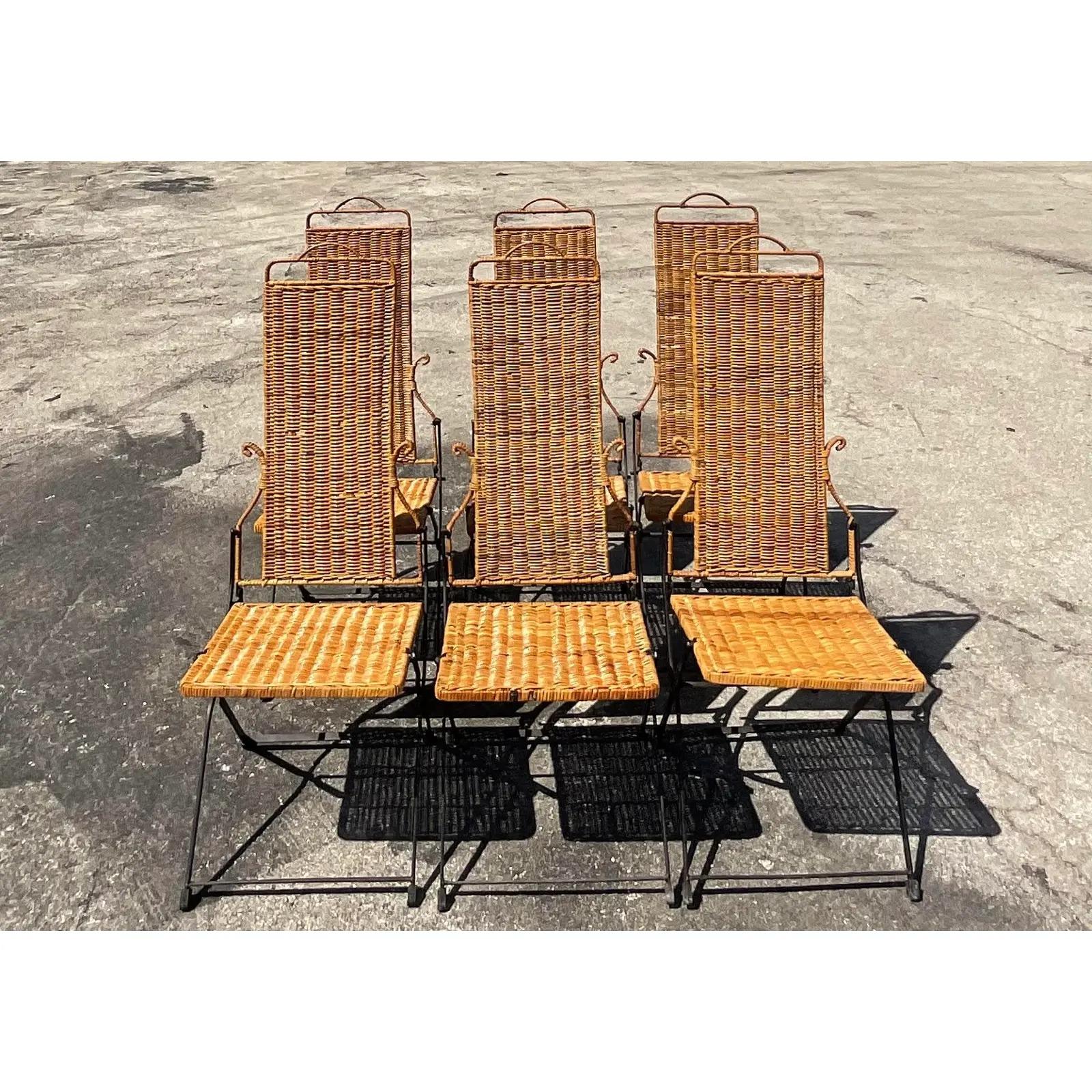 Fantastic set of 6 vintage Coastal dining chairs. Beautiful woven rattan on a sleek metal frame. Chic Midcentury details to the design. Great for indoors or outside in a covered area. Acquired from a Miami estate.