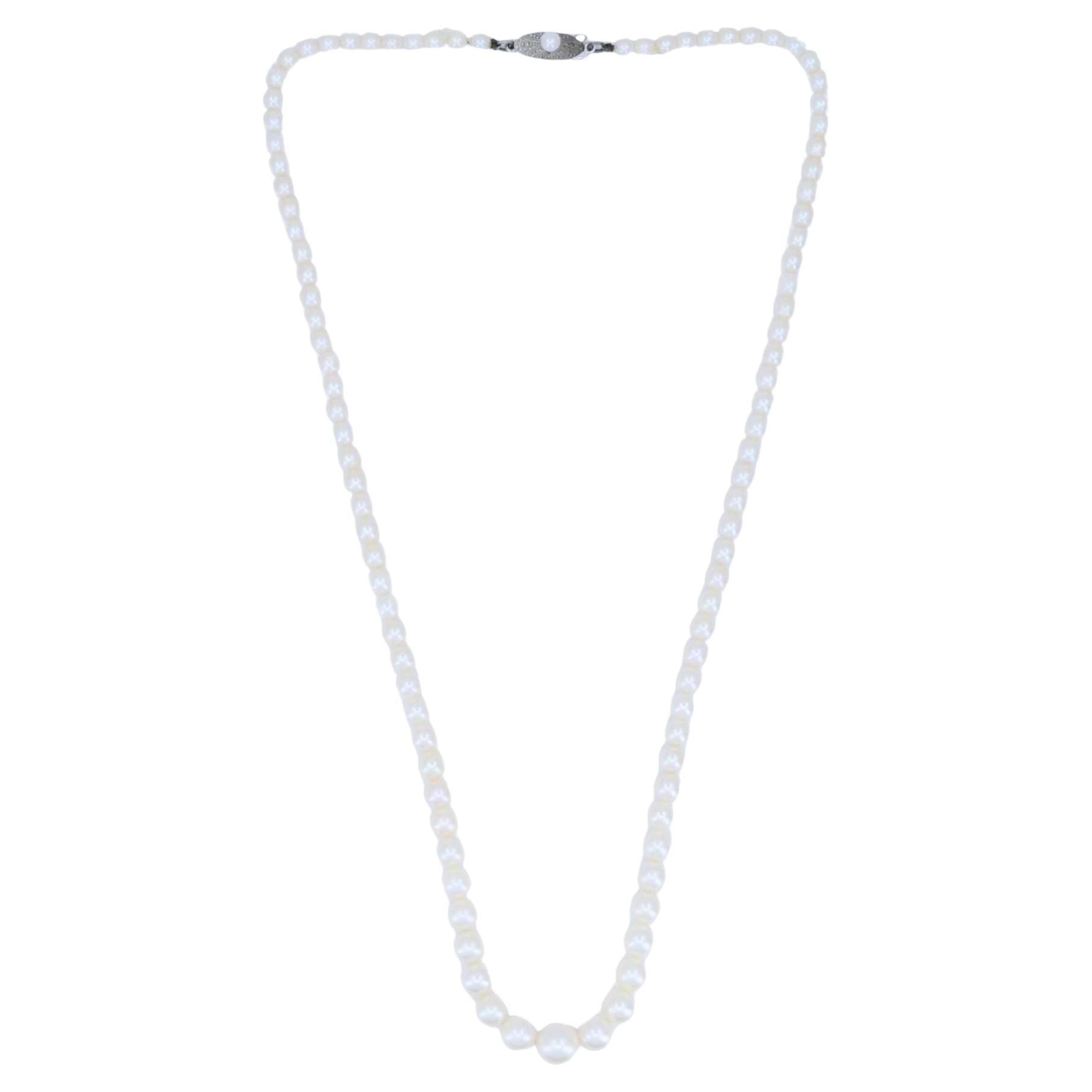 How can I tell if Mikimoto pearls are vintage?