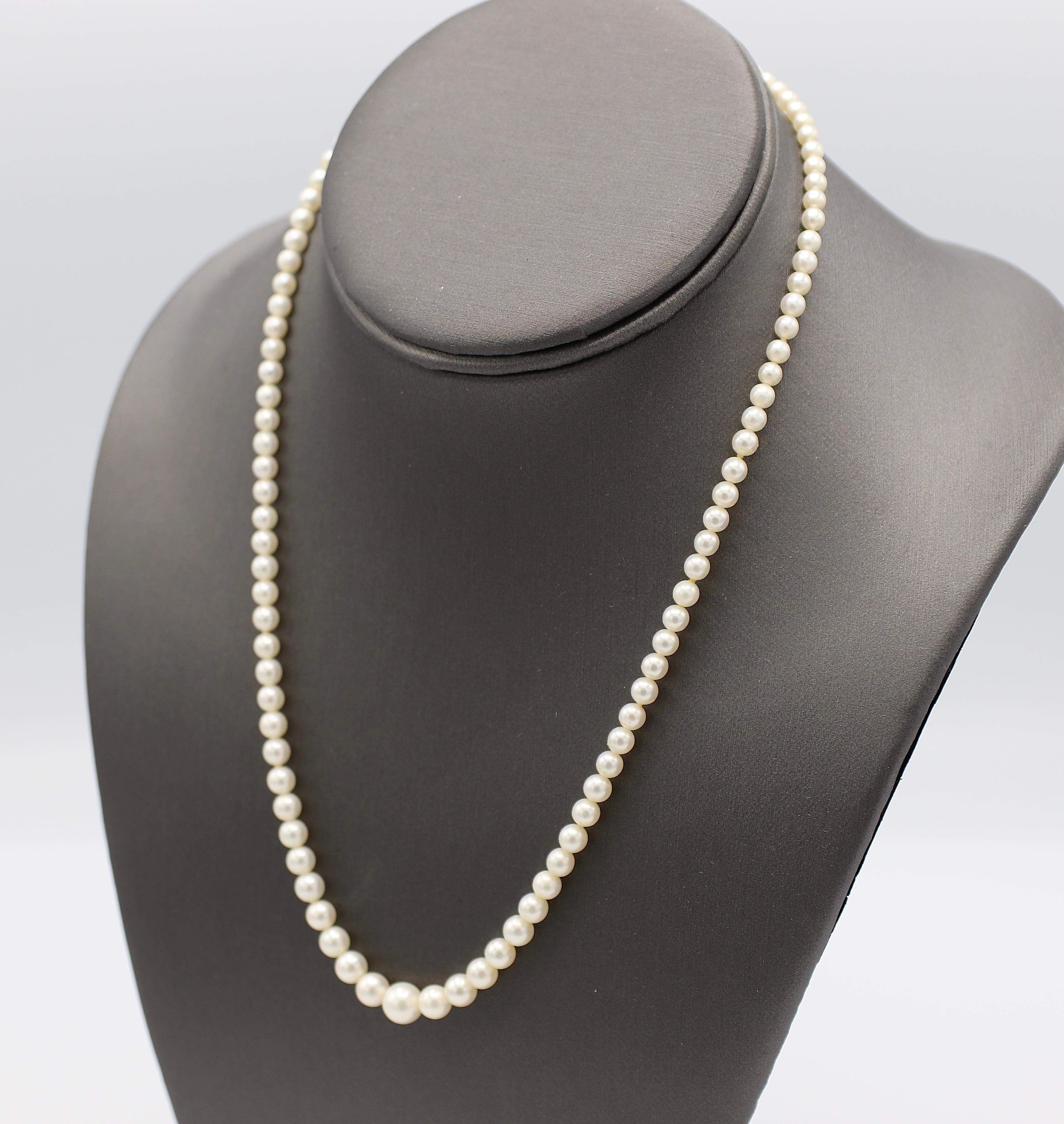 Vintage Mikimoto Cultured Pearl Graduated Necklace Sterling Silver Clasp with original Box & Papers 

Metal: Sterling Silver 
Weight: 13.64 grams
Pearls: 3.5mm - 7.2mm white in color with creamy luster 
Length: 18 inches 
Box & Papers 
Papers dated