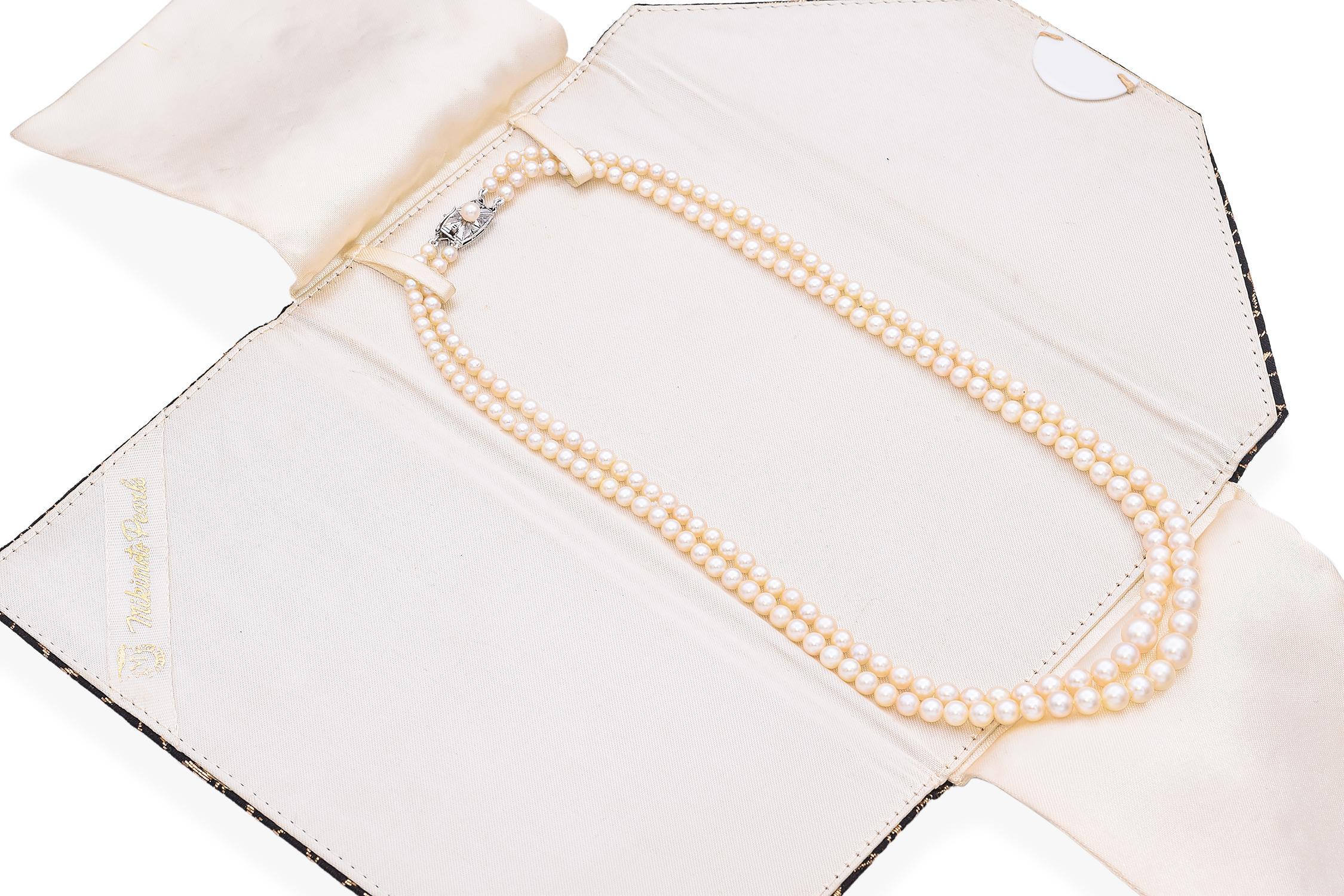This refined double-strand necklace is meticulously crafted with lustrous pearls. The necklace features a classic design with uniform pearls, each exhibiting a soft, creamy hue.
The clasp is adorned with a single pearl, set in an intricate sterling