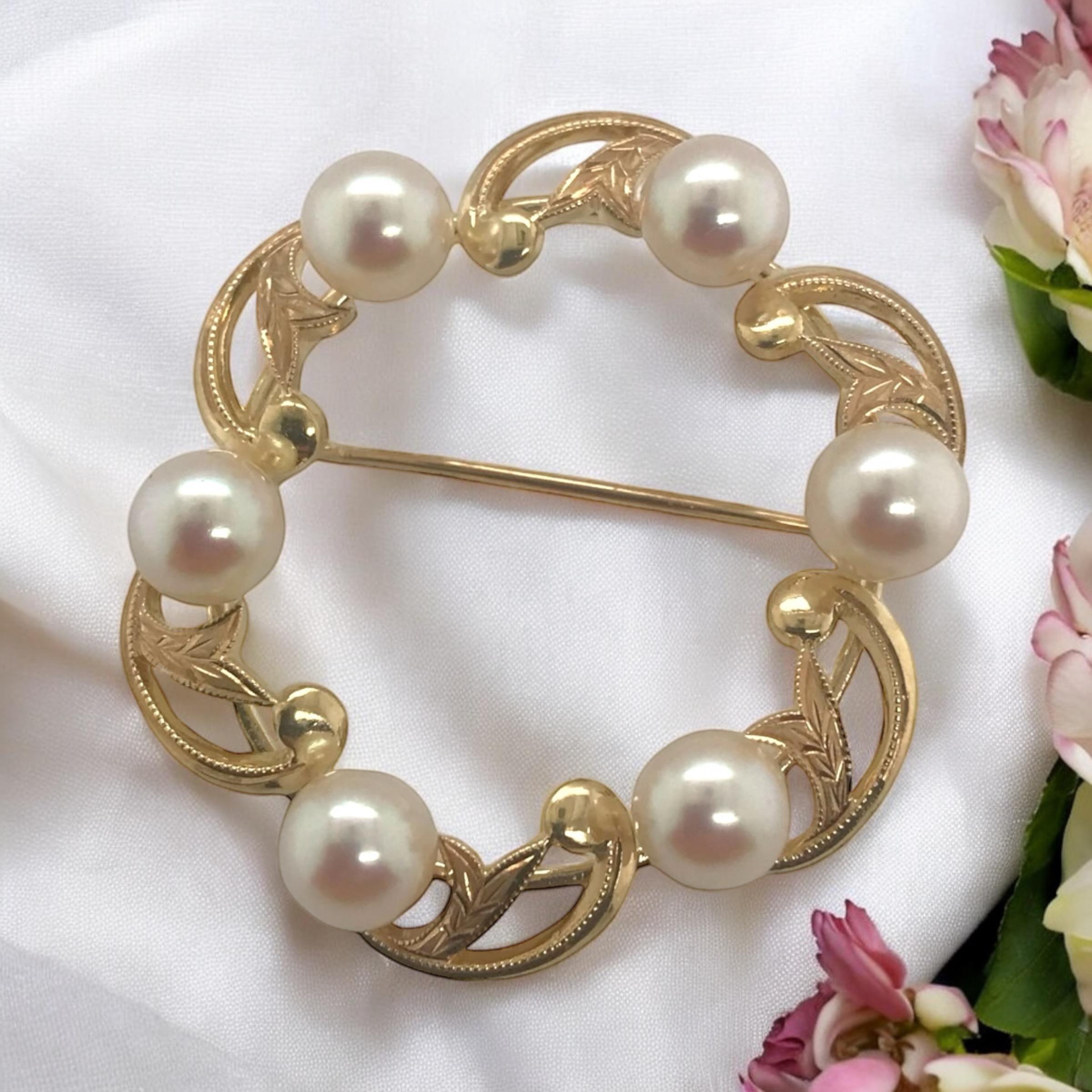 Mikimoto is known for being the gold standard in cultured pearls.
This Vintage beauty exhibits just that.
Great metal work along with perfect quality pearl accents.

Brooch Details
Material: 14K Yellow Gold
Designer: Mikimoto
Weight: 7.7
