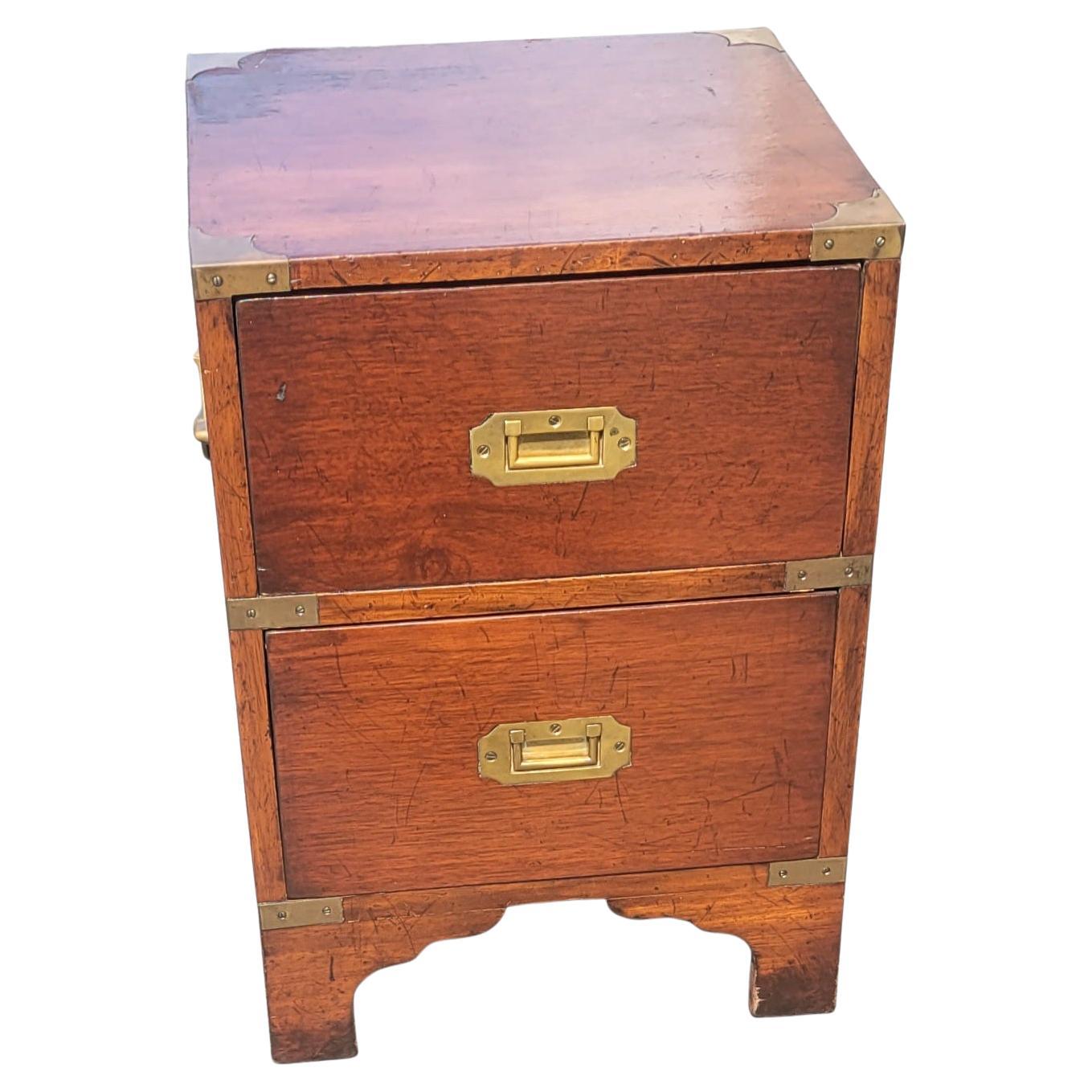 Recently refinished charming petite military campaign style bedside chest of drawer. Measures 15