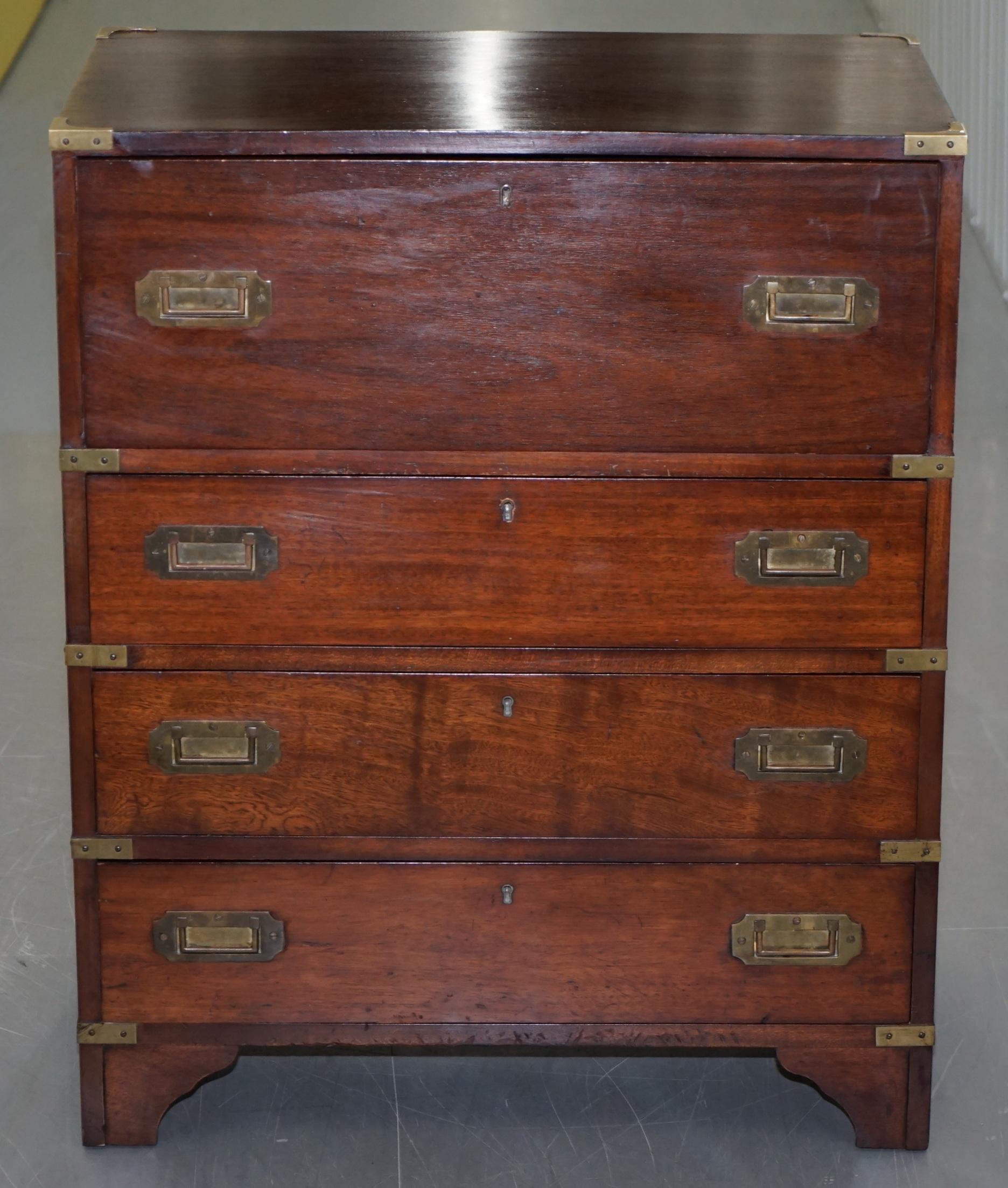 We are delighted to offer for sale this lovely Military Campaign style chest of drawers with drop front top drawer revealing a sliding secrataire desk

A good looking and compact desk in period lightly restored condition throughout, this piece is