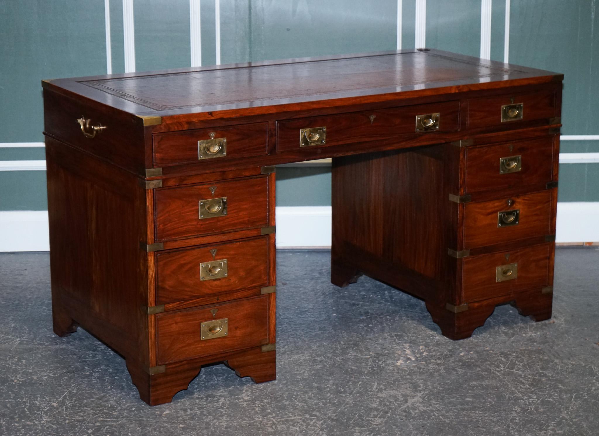 We are delighted to present this stunning Vintage Military Campaign twin pedestal desk.

A beautiful desk, in the traditional campaign style. There are nine drawers to give you plenty of storage.
All drawers have a lock. There are brass handles on