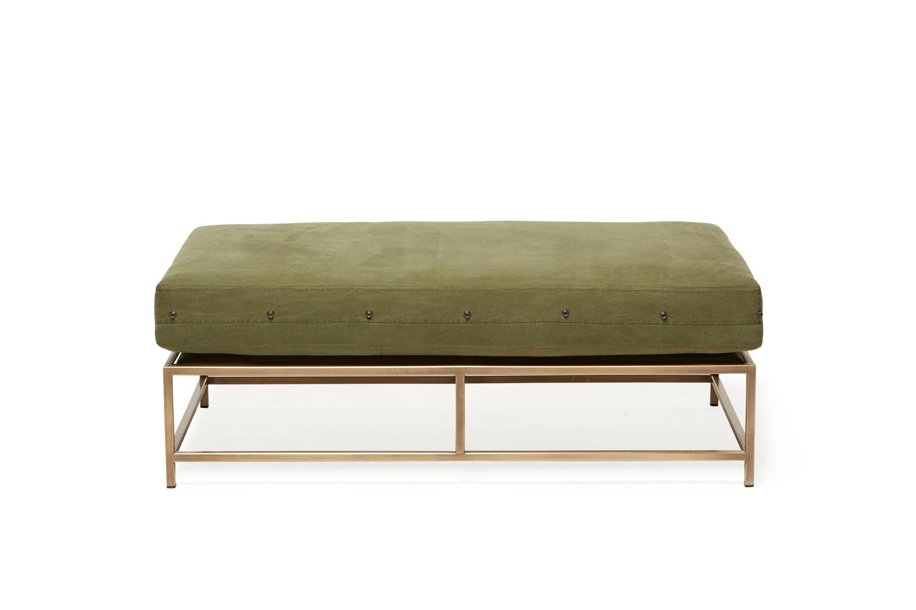 The Inheritance Bench can be used as a chaise extension on the sofa or two-seat sofa, as an independent seating option, or as a large upholstered coffee table in front of a sofa or chair. This version has an antique brass frame finish and vegetable