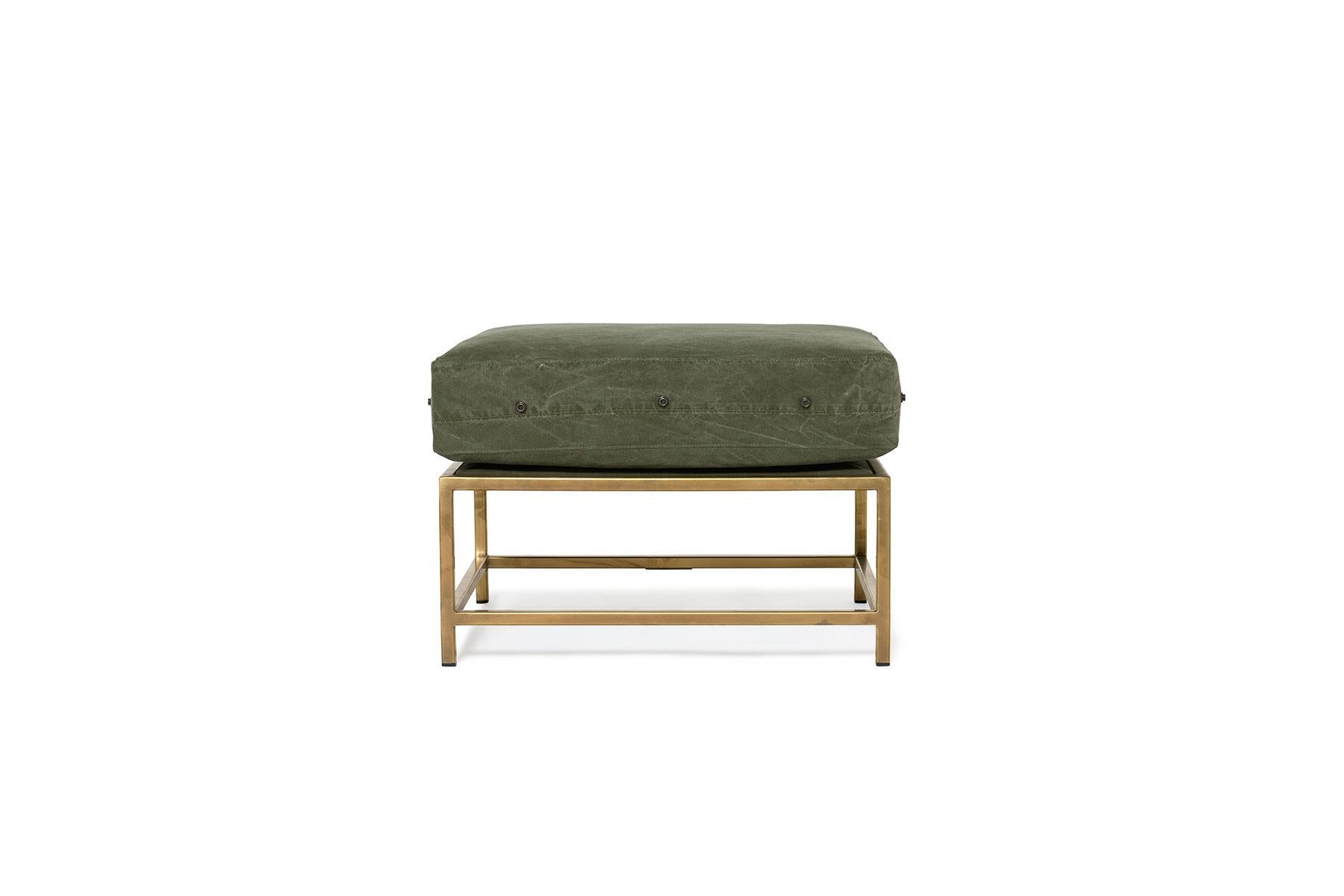 The Inheritance Ottoman by Stephen Kenn is as comfortable as it is unique. The design features an exposed steel frame and a plush upholstered top. This versatile piece can function as seating, a sofa chaise extension, or a footstool and can pair