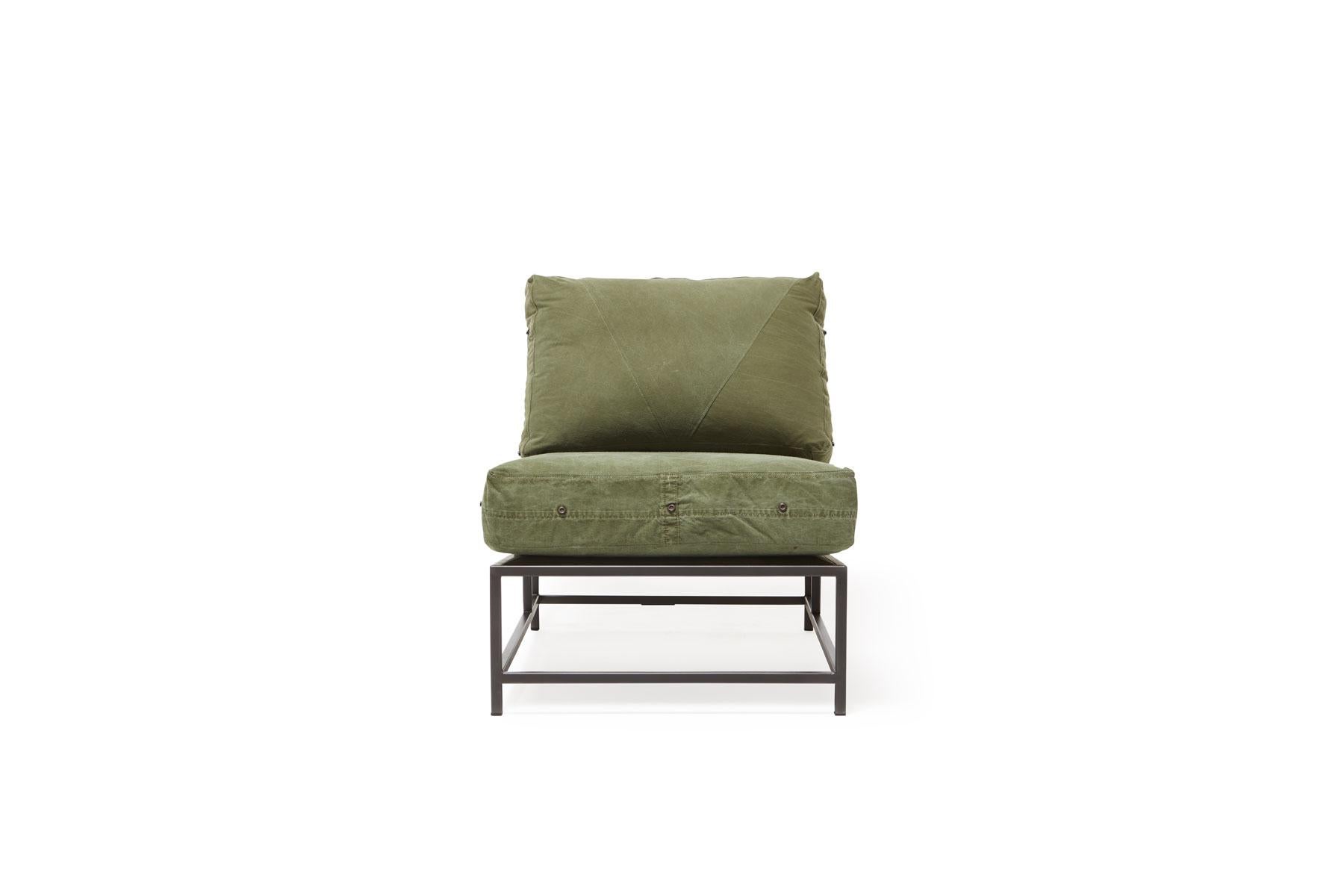 The Inheritance chair by Stephen Kenn is as comfortable as it is unique. The design features an exposed construction composed of three elements - a steel frame, plush upholstery, and supportive belts. The deep seating area is perfect for a relaxing