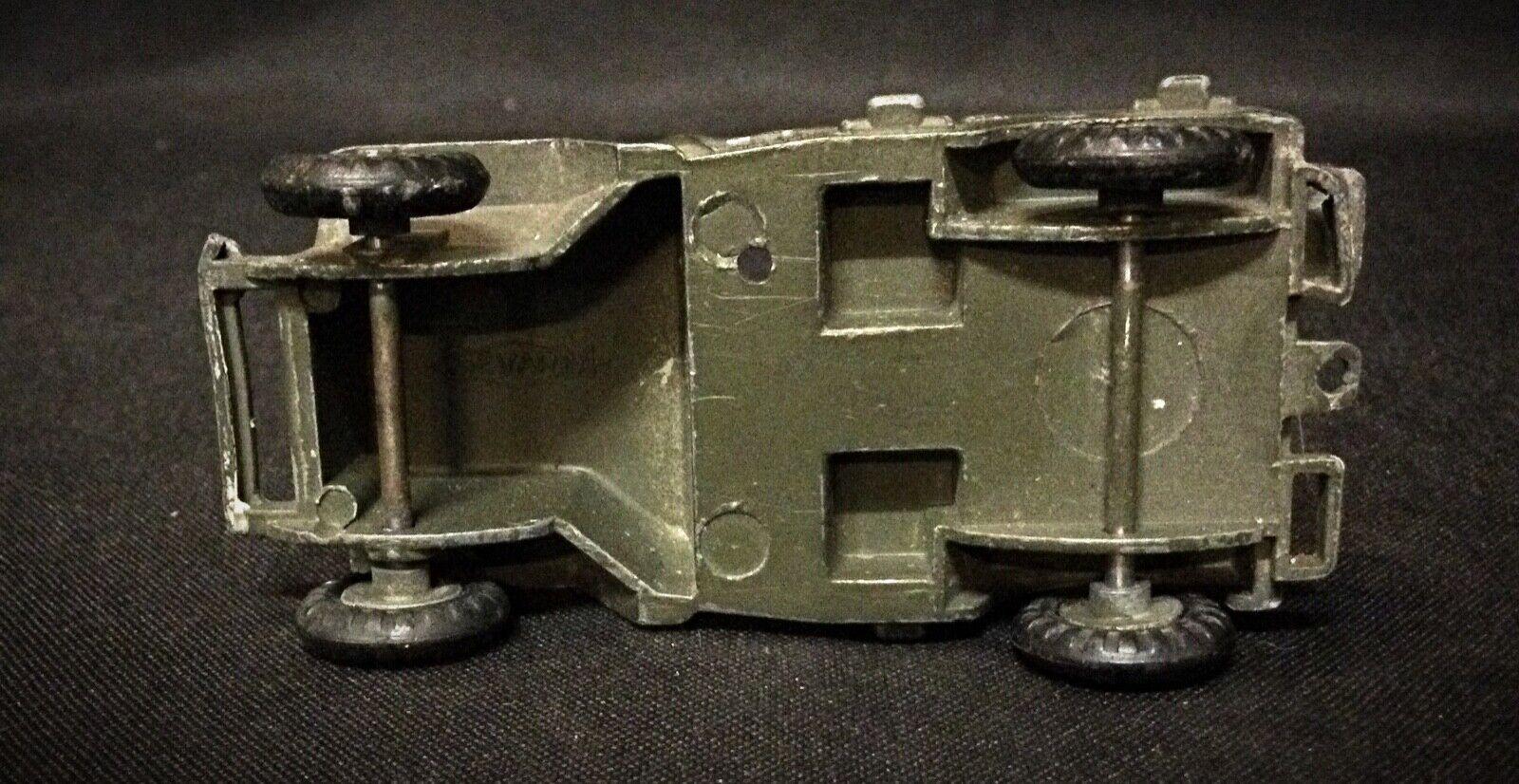 Explore a piece of history with this vintage military toy car from France Jouets. This classic collectible is a testament to mid-20th-century craftsmanship, capturing the essence of vintage military design. The car is in used condition with some