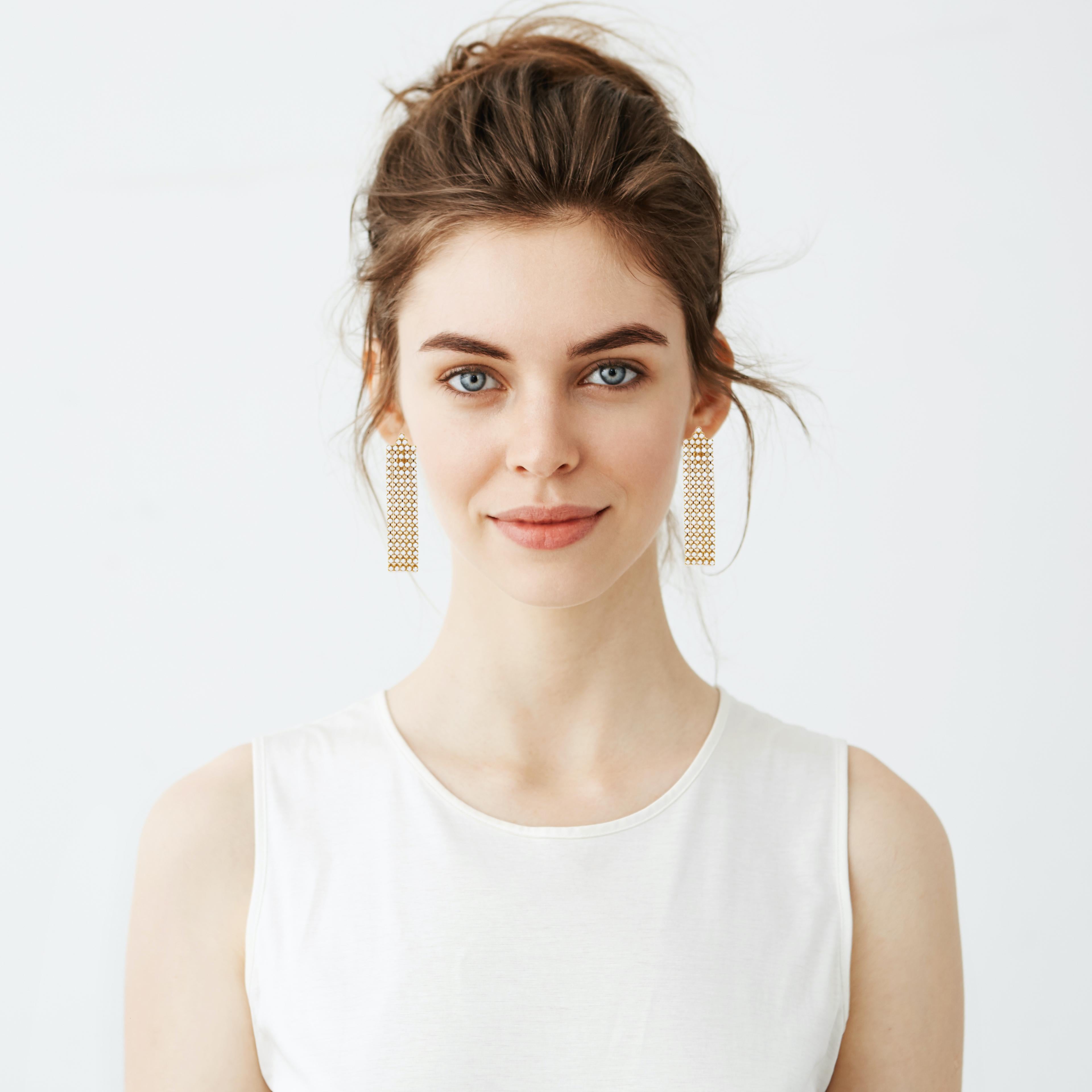 These chic vintage gold-plated milk glass rhinestone chandelier clip-on earrings are a must-have for vintage jewelry lovers! Fringe-style chandelier earrings have been a popular trend for decades. Perfect for fashionistas and vintage lovers, these