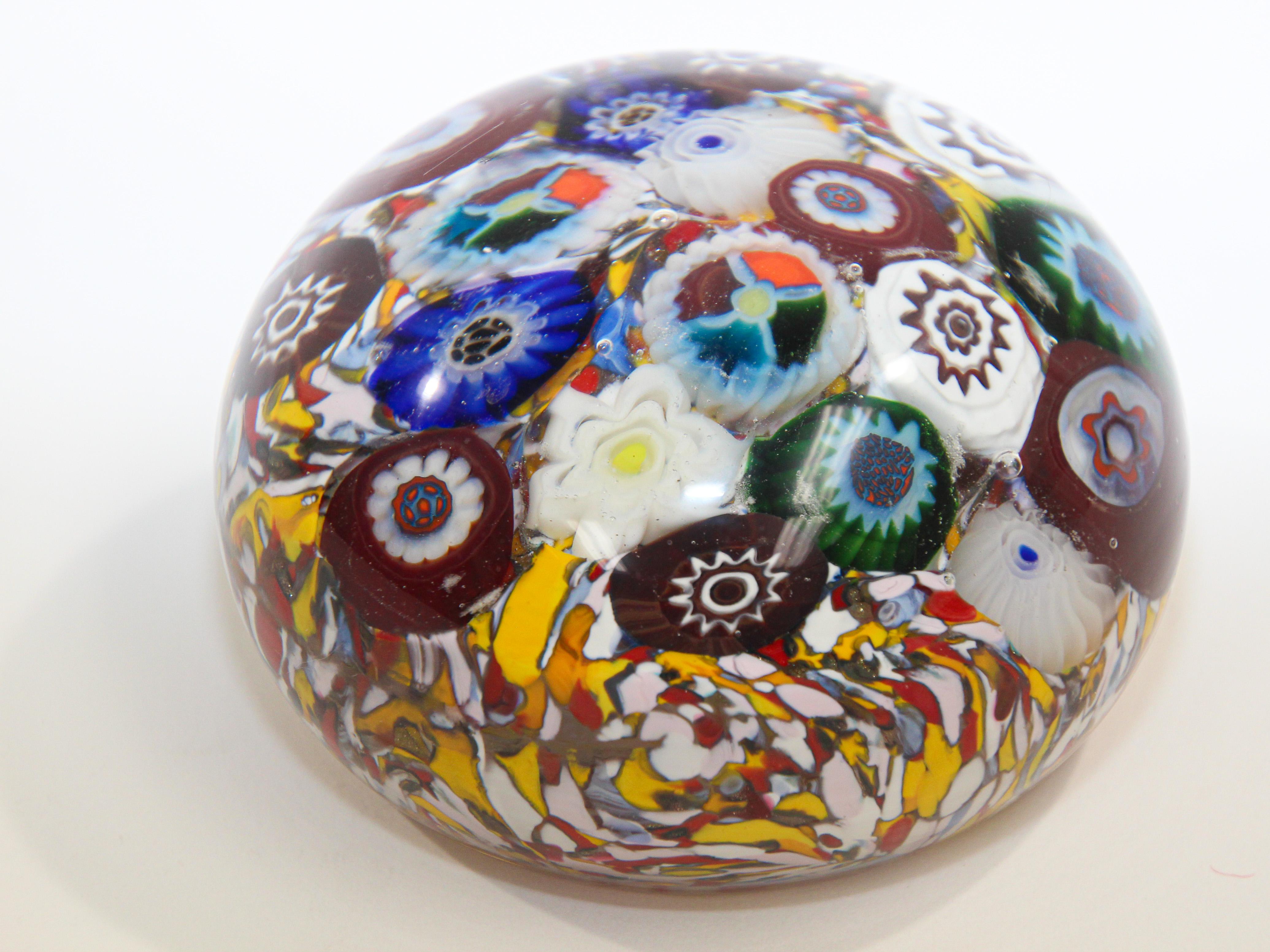 Large vintage Millefiori Flowers Murano style Italian art glass paperweight.
Millefiori Flowers Murano style Italian Art Glass Paperweight, 1960s.
Beautiful Murano hand blown Italian art glass paper weight. 
Fratelli Toso Murano Millefiori style