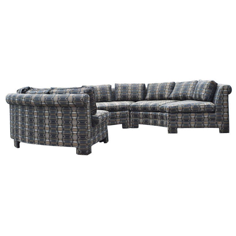 Super chic circular sectional sofa by Milo Baughman.  Consists of 3 sections with upholstered feet.