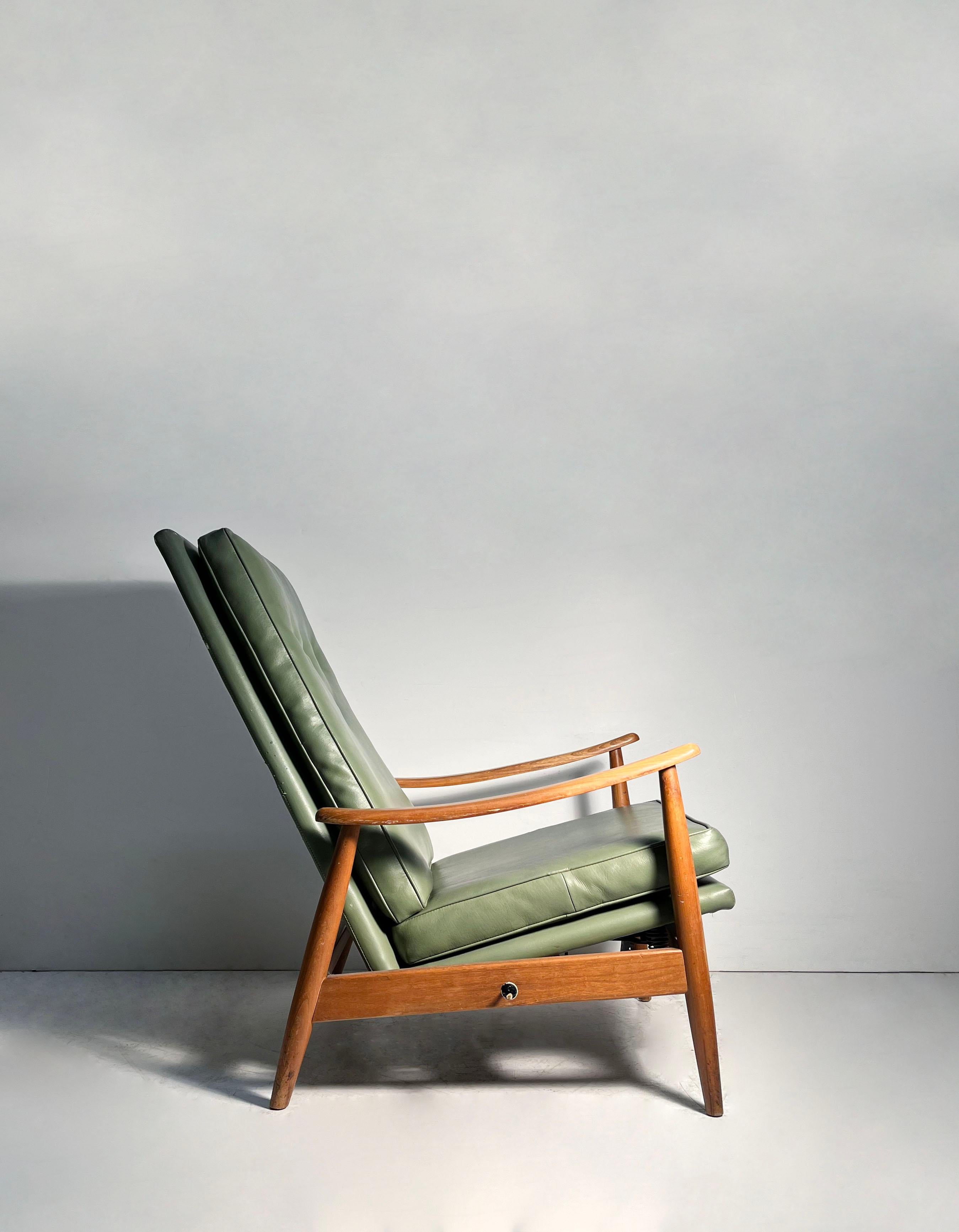 A very nice and early Vintage Milo Baughman Recliner Lounge Chair.

This chair will most likely need some attention at a workshop as the joints have weakened over time.  Original upholstery as well with some wear and missing button. The metal pull
