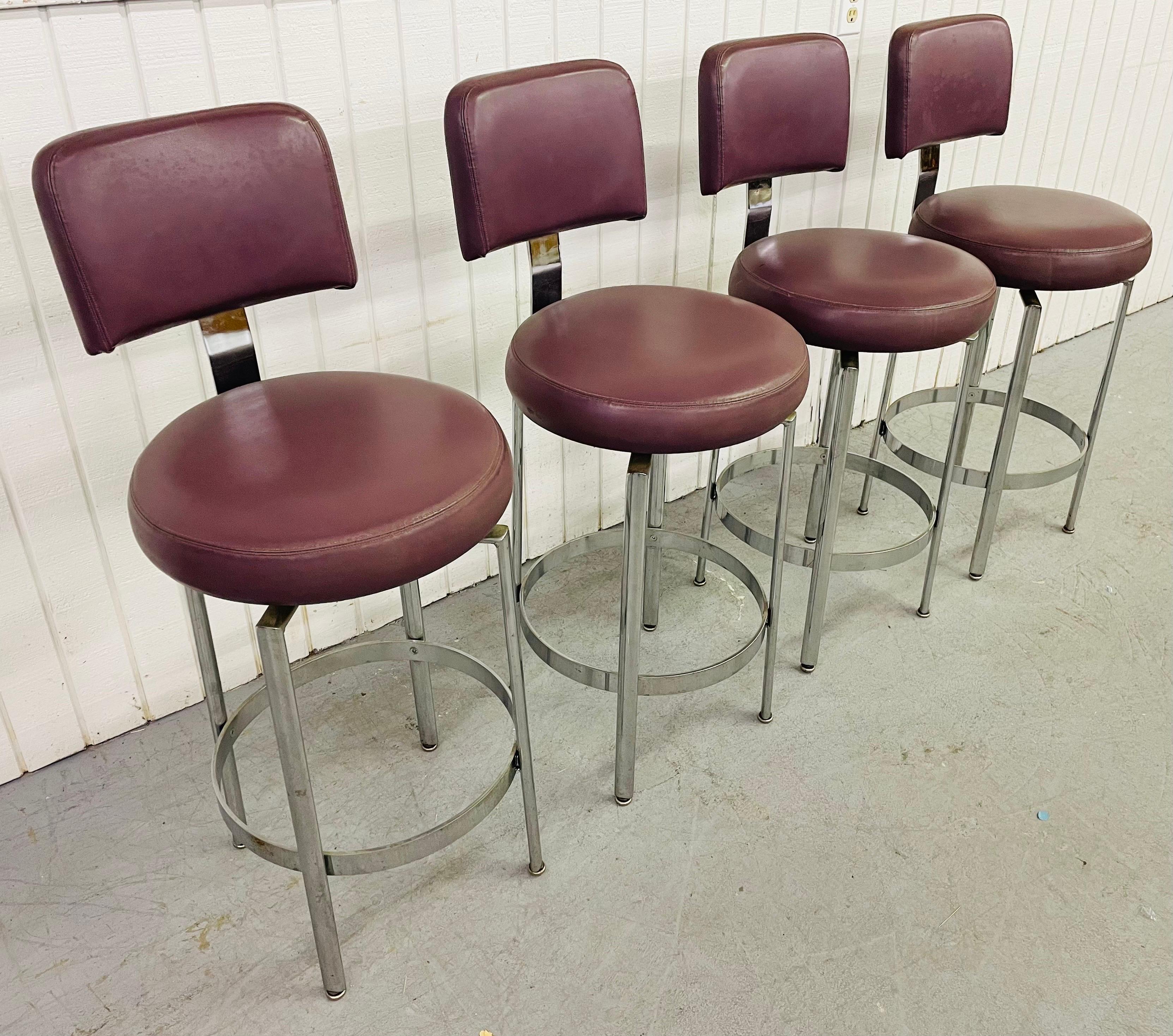 This listing is for a set of four Vintage Milo Baughman Style Bar Stools. Featuring purple leather upholstery, swivel seats, and chrome legs.