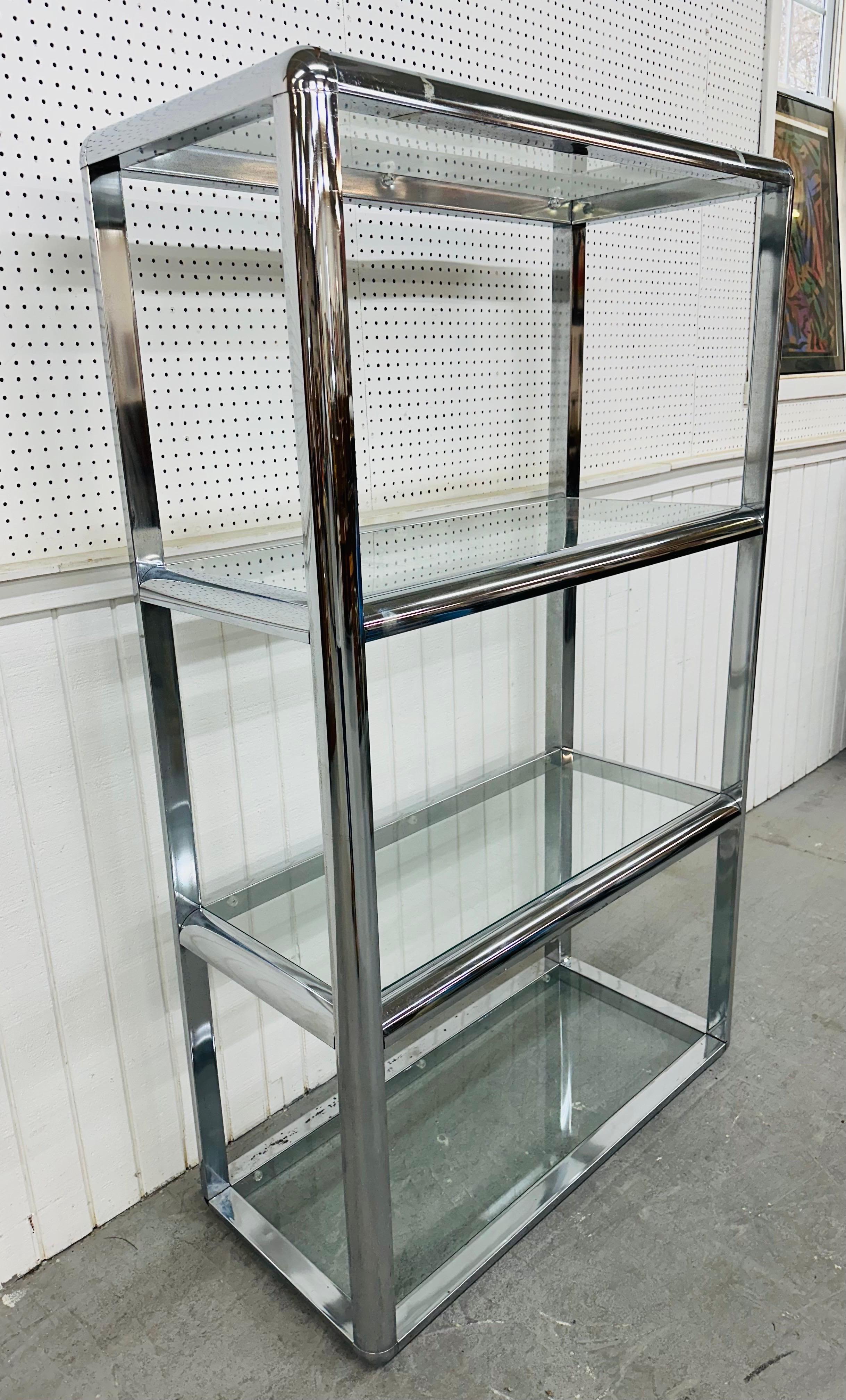 This listing is for a Vintage Milo Baughman Style Chrome Etagere. Featuring a straight line design, flat bar chrome frame, and four glass shelves to display items. This is an exceptional combination of quality and design in the style of designer