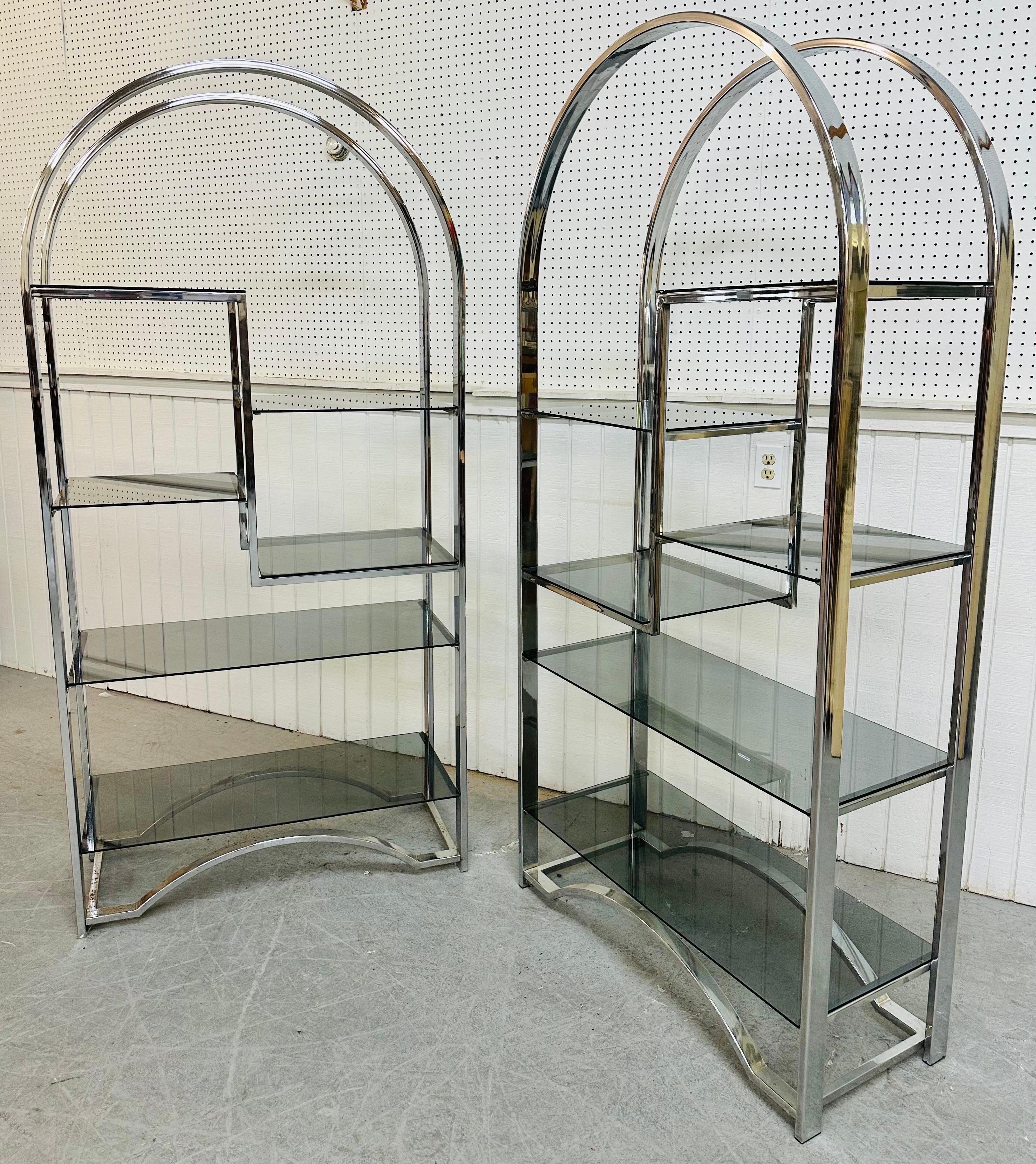 This listing is for a pair of vintage Milo Baughman Style Flat Bar Chrome Etageres. Featuring rounded tops, six smoked glass shelves, and a chrome frame. This is an exceptional combination of quality and design.