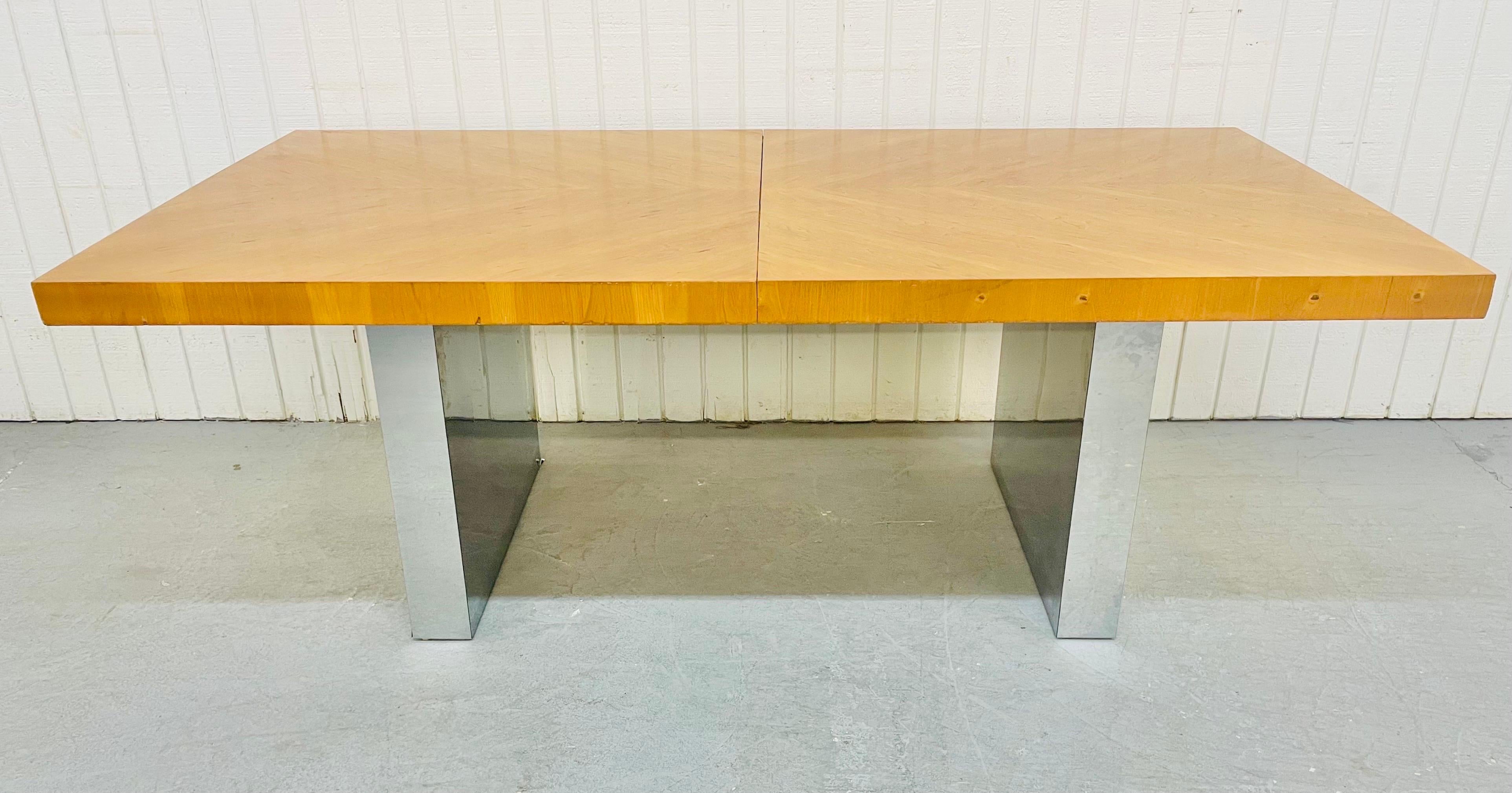 This listing is for a vintage Milo Baughman style oak and chrome dining table. Featuring an rectangular oak top, chrome base, and one leaf to extend the table up to 100.25” L.