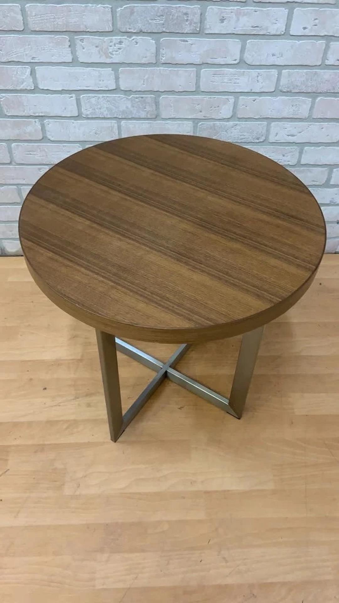 Vintage Milo Baughman Style Round Teak and Chrome Side/End Table

This vintage Milo Baughman style round teak and chrome side/end table exemplifies mid-century modern design, featuring a sleek round teak top that beautifully contrasts with its