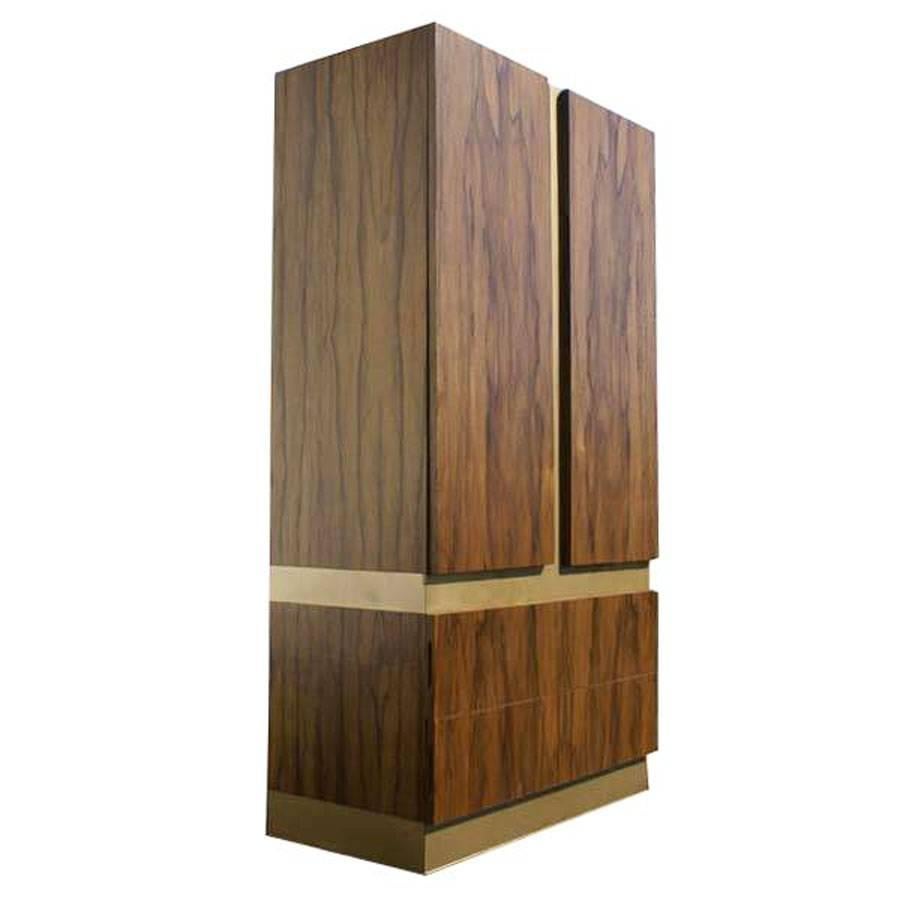 Milo Baughman Thayer Coggin rosewood wardrobe armoire
1970 design
 
 
Rosewood composition with gold brass trim 
(Two) regular drawers, (two) shelves, (six) pull out ebonized shelves, (two) opposing cabinet doors.
 