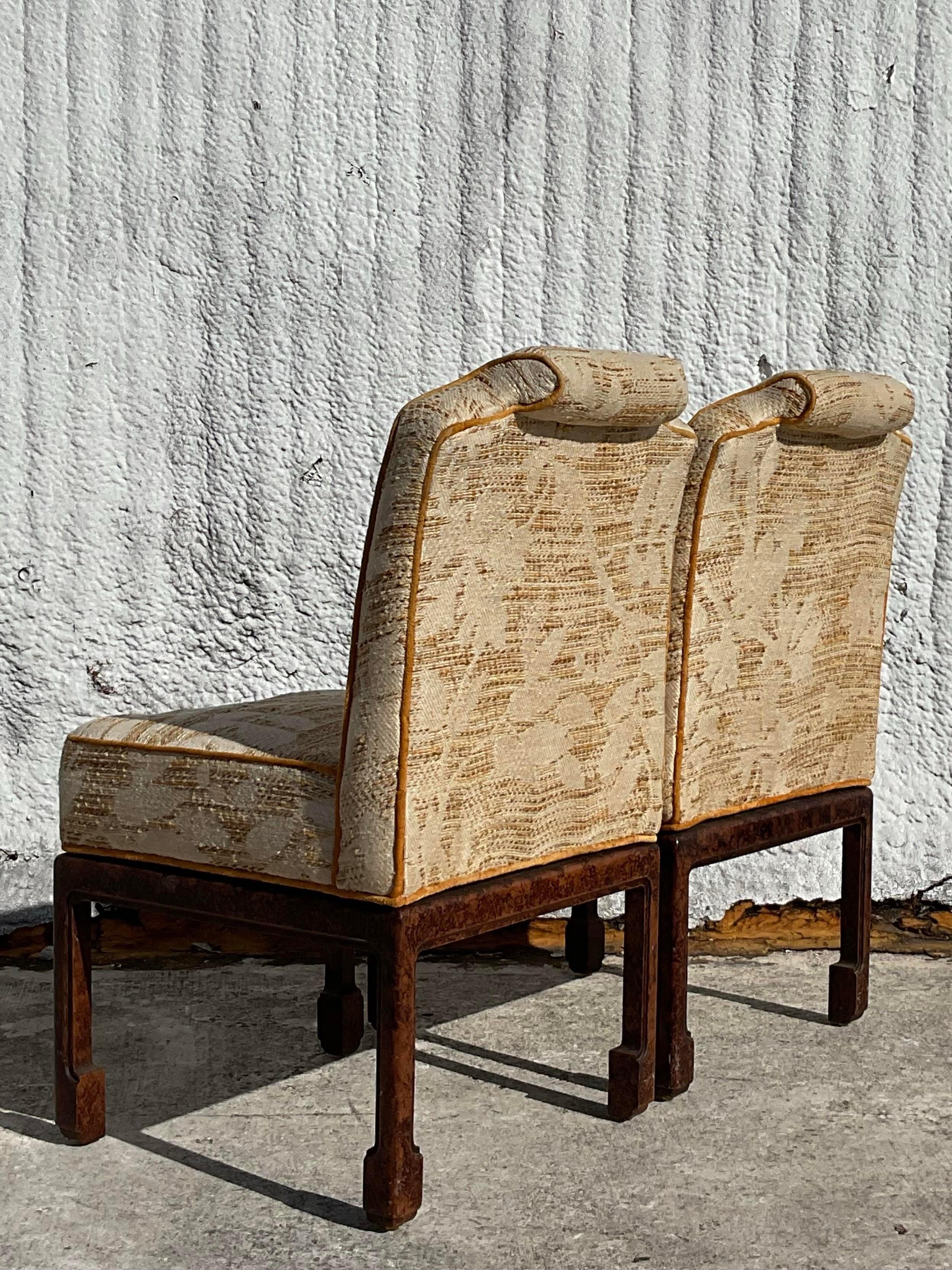 Gorgeous pair of vintage Ming foot slipper chairs with an intricate faux tortoise finish to its legs and a thick tweed with and piping accent. Fabulous addition to any space. Would be gorgeous hall chairs or occasional chairs flanking a credenza.