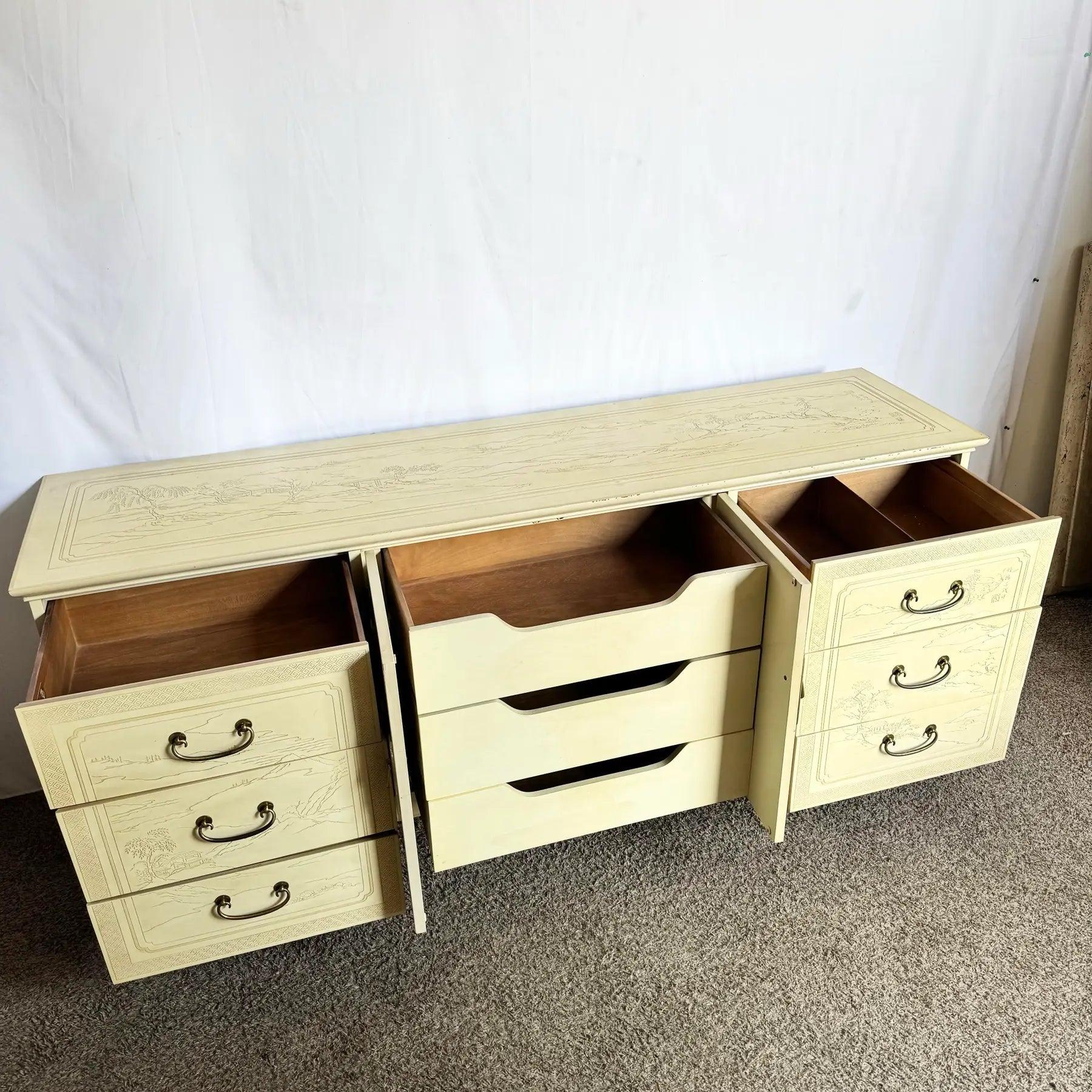Vintage Ming Style Dresser showcases Drexel Heritage’s Chinoiserie elegance with etched detail and folding mirror functionality.
 

 Some wear and discoloration on the surfaces and edges as seen in the photos. 
 

 We sell items as acquired, without