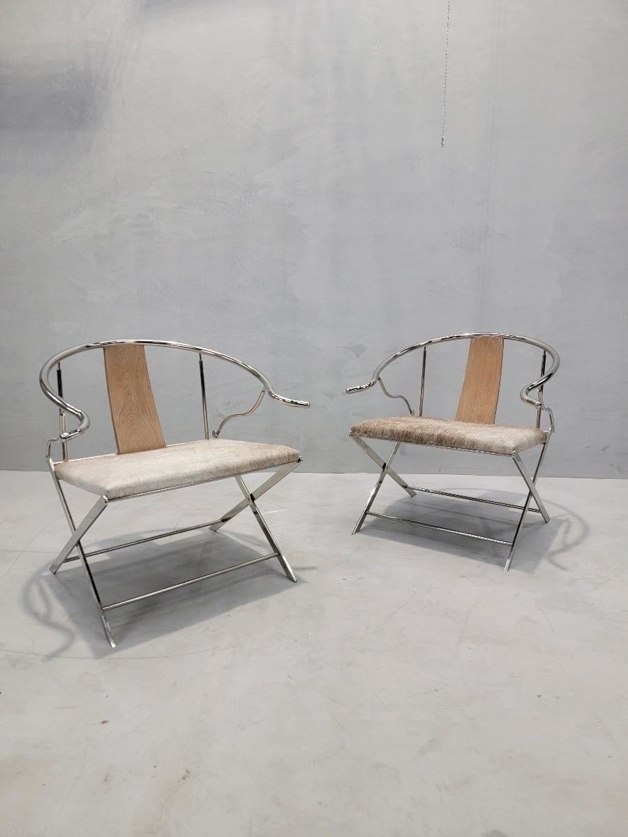 Vintage Ming Style Horseshoe Back Armchairs with Stainless Steel Frame and Newly Upholstered Seats in Cow Hide - Pair

This stylish and chic modern set take on a Classic Chinese 