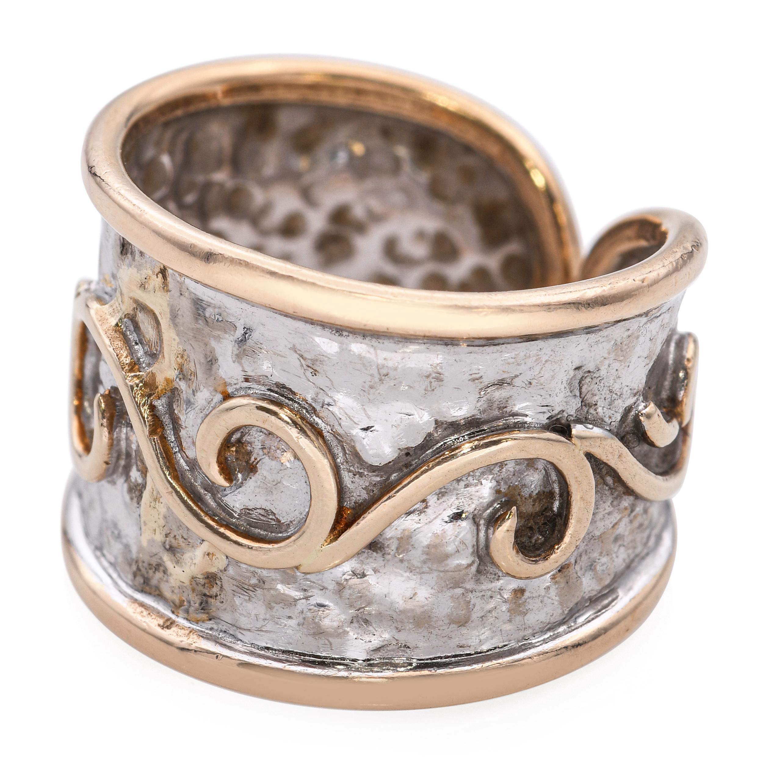 A rare and collectible piece by the iconic Ming’s of Honolulu, this vintage open ring is crafted in 14k two-tone gold. The design showcases a beautifully hammered yellow gold band with intricately chased white gold accents, forming a fluid and