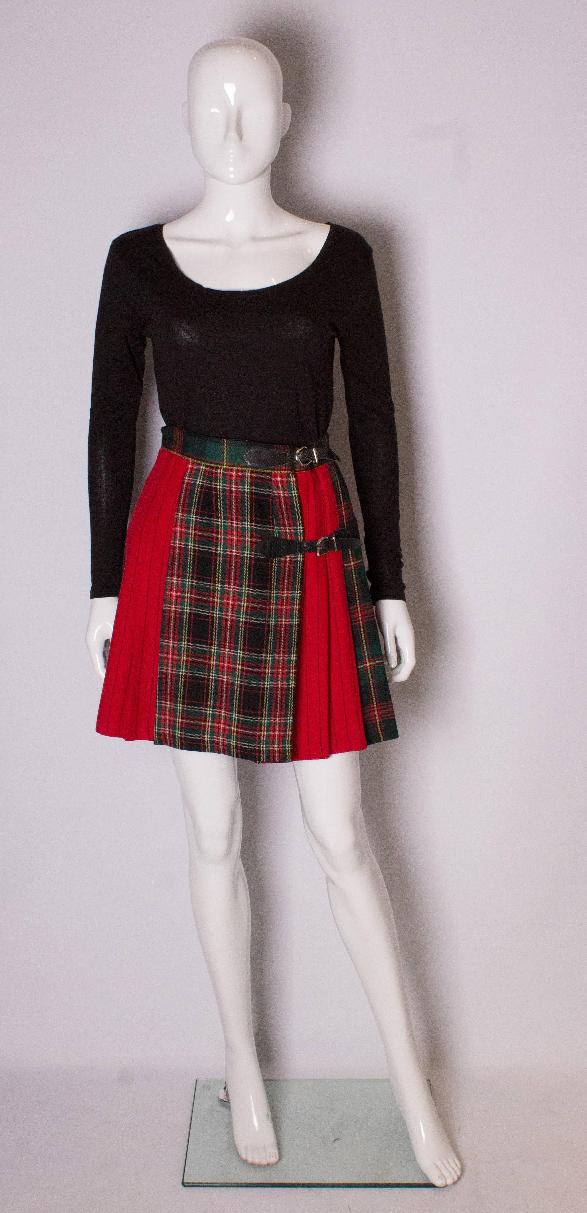 A great mink skirt kilt in a mix of stripe and tartan fabric. The pleats start at hip level , leaving a smooth line down from from the waist.