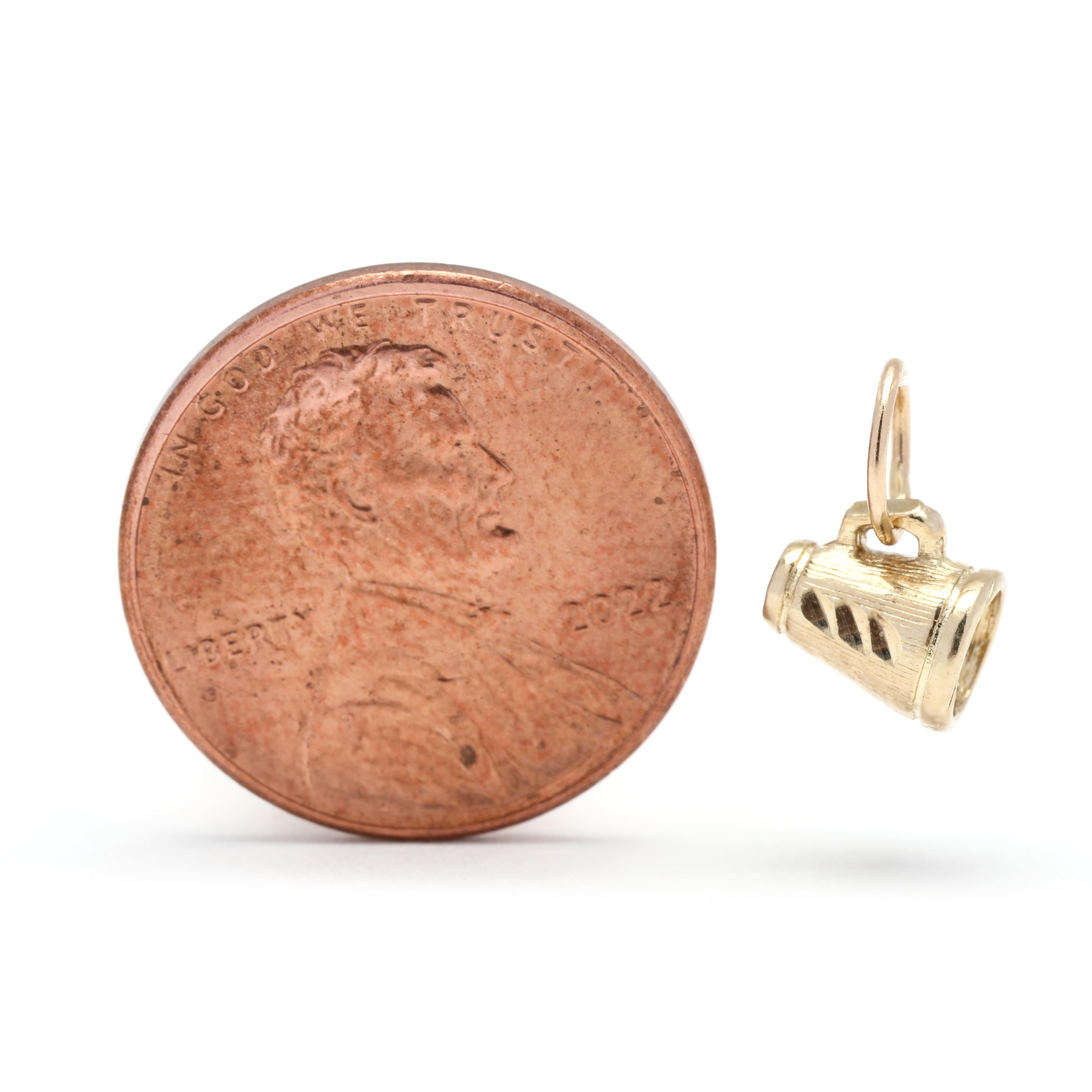 This vintage mini megaphone charm is crafted from 14K yellow gold and measures 3/8 inch in length. This charm is perfect for any cheerleader or fan of vintage jewelry. The beautiful gold megaphone is a great reminder of cherished memories and a fun